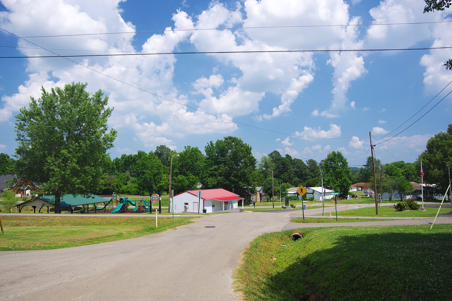 View along Willis Drive in Powderly, Kentucky, United States, with the park and community center on the left.