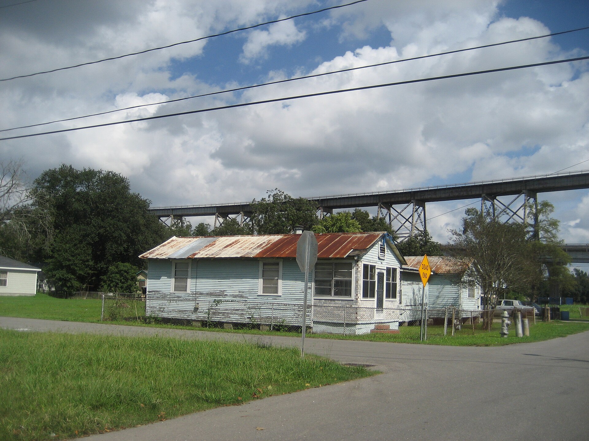 Bridge City, Louisiana. Residential architecture, with ramp for Huey P. Long Bridge in background.