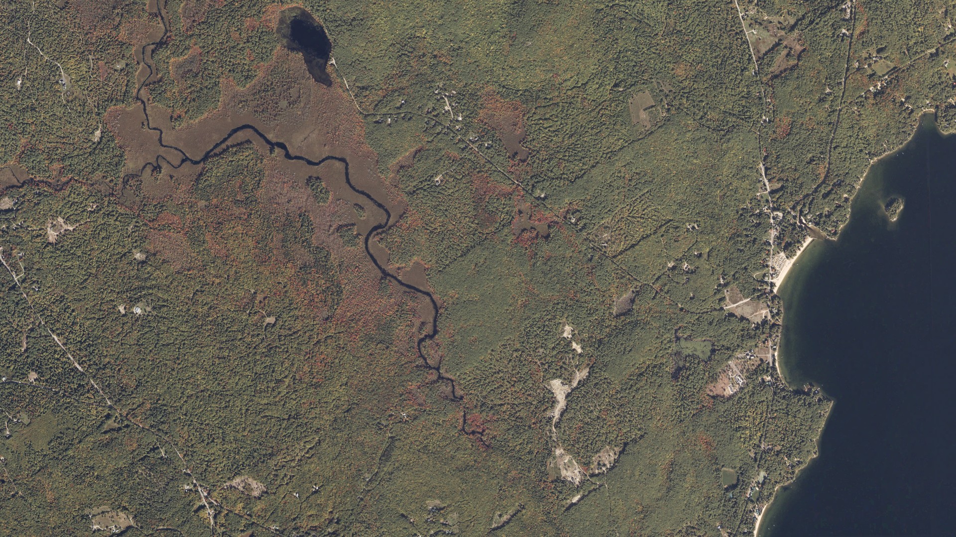 Natural-color aerial photograph of land around Sebago, Maine