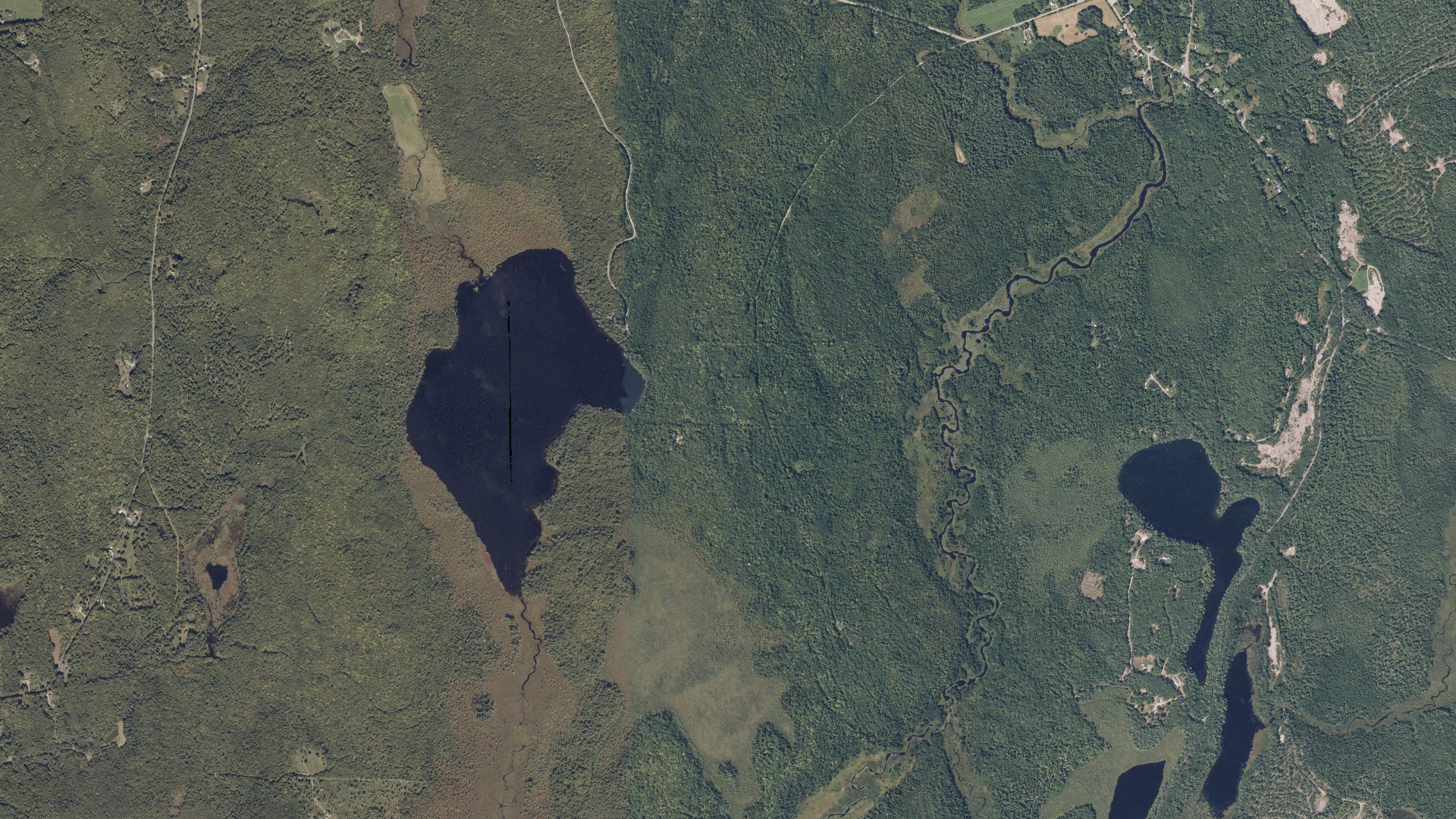 Natural-color aerial photograph of land around Chesterville, Maine
