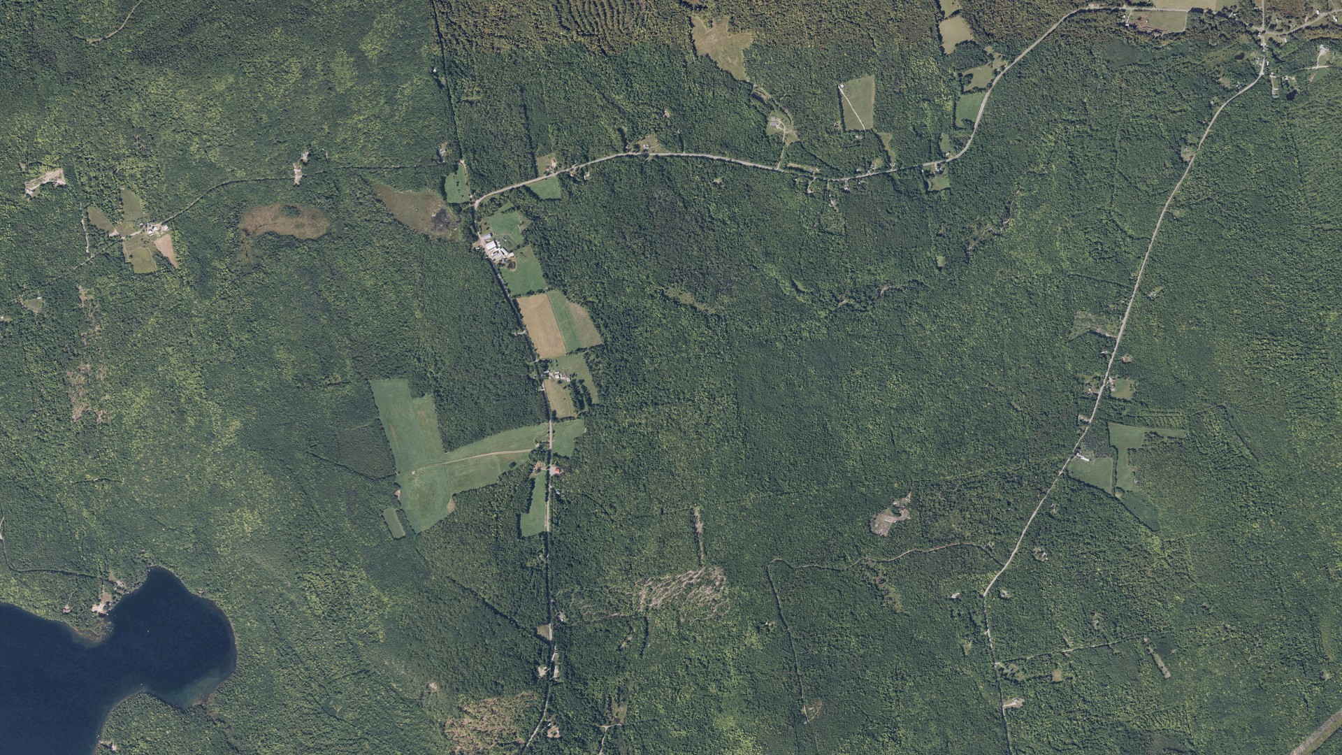 Natural-color aerial photograph of land around Industry, Maine