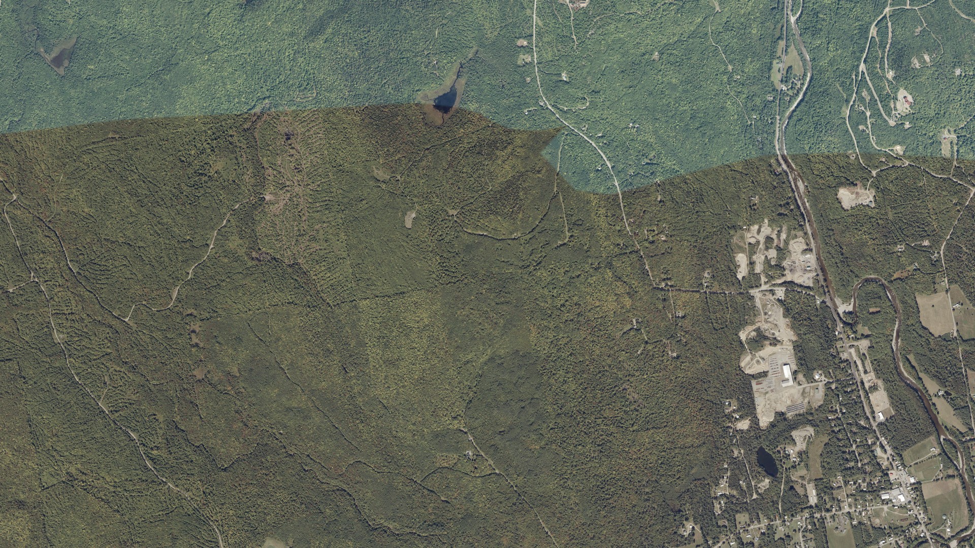 Natural-color aerial photograph of land around Kingfield, Maine