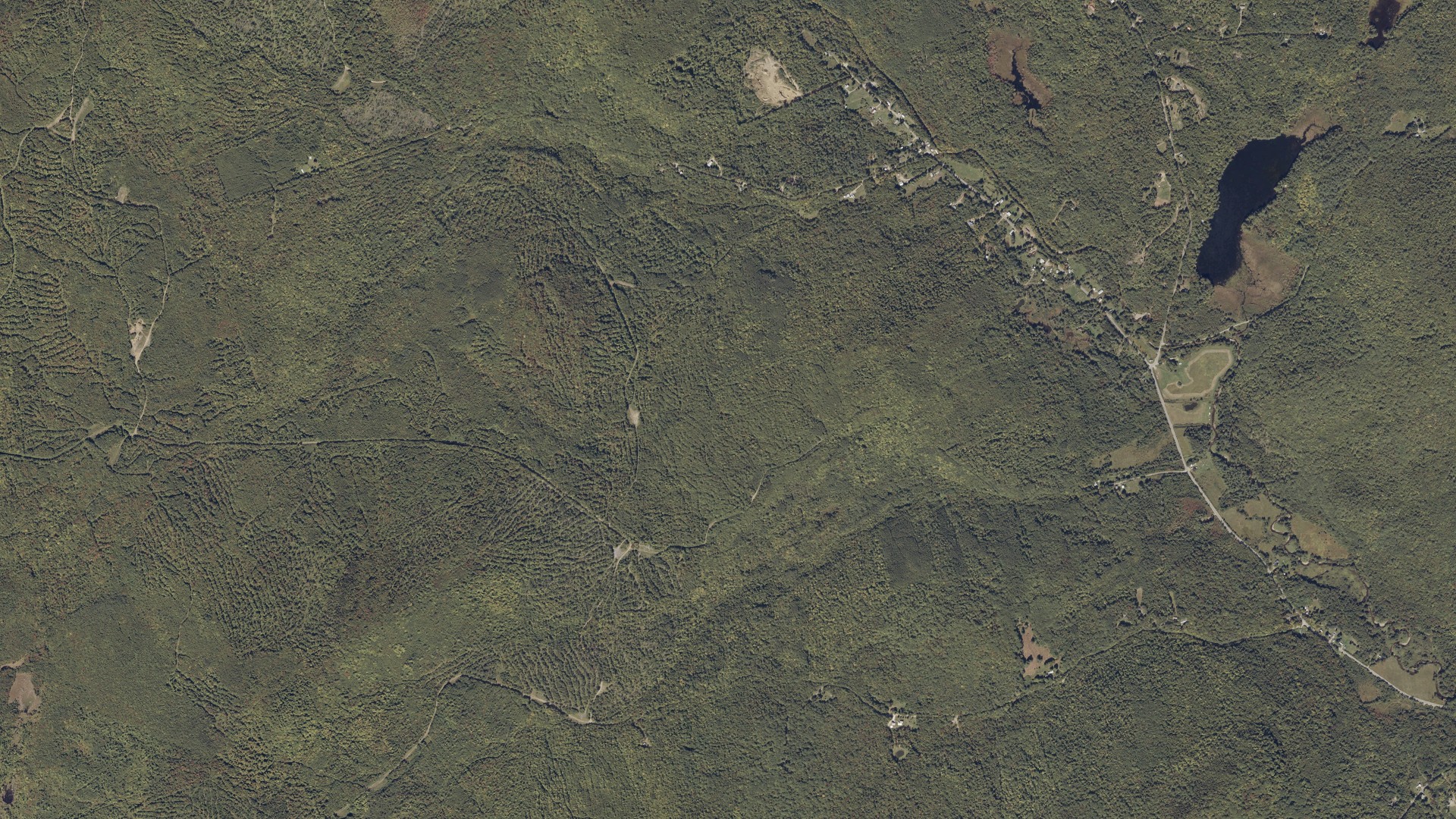 Natural-color aerial photograph of land around Temple, Maine