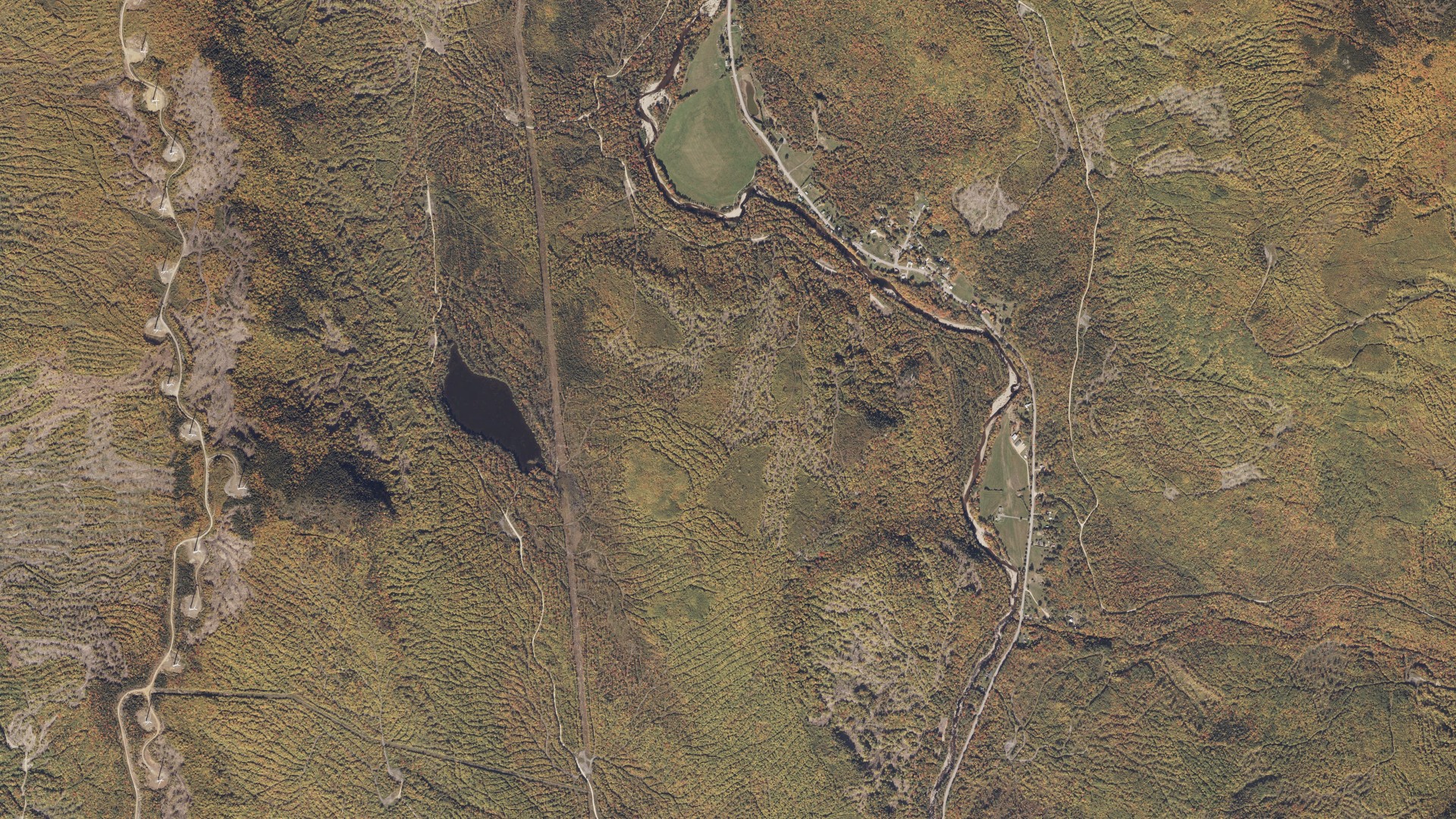 Natural-color aerial photograph of land around Roxbury, Maine