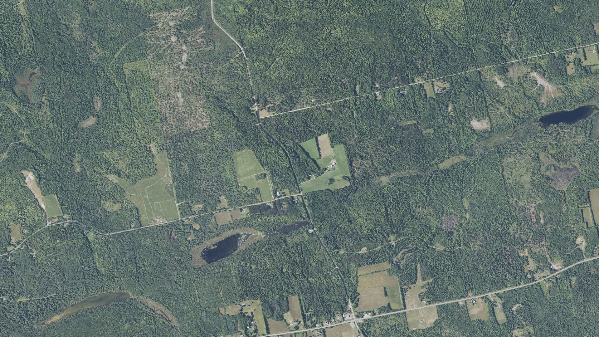 Natural-color aerial photograph of land around Sebec, Maine