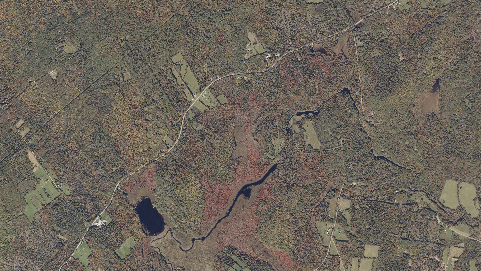 Natural-color aerial photograph of land around Monroe, Maine