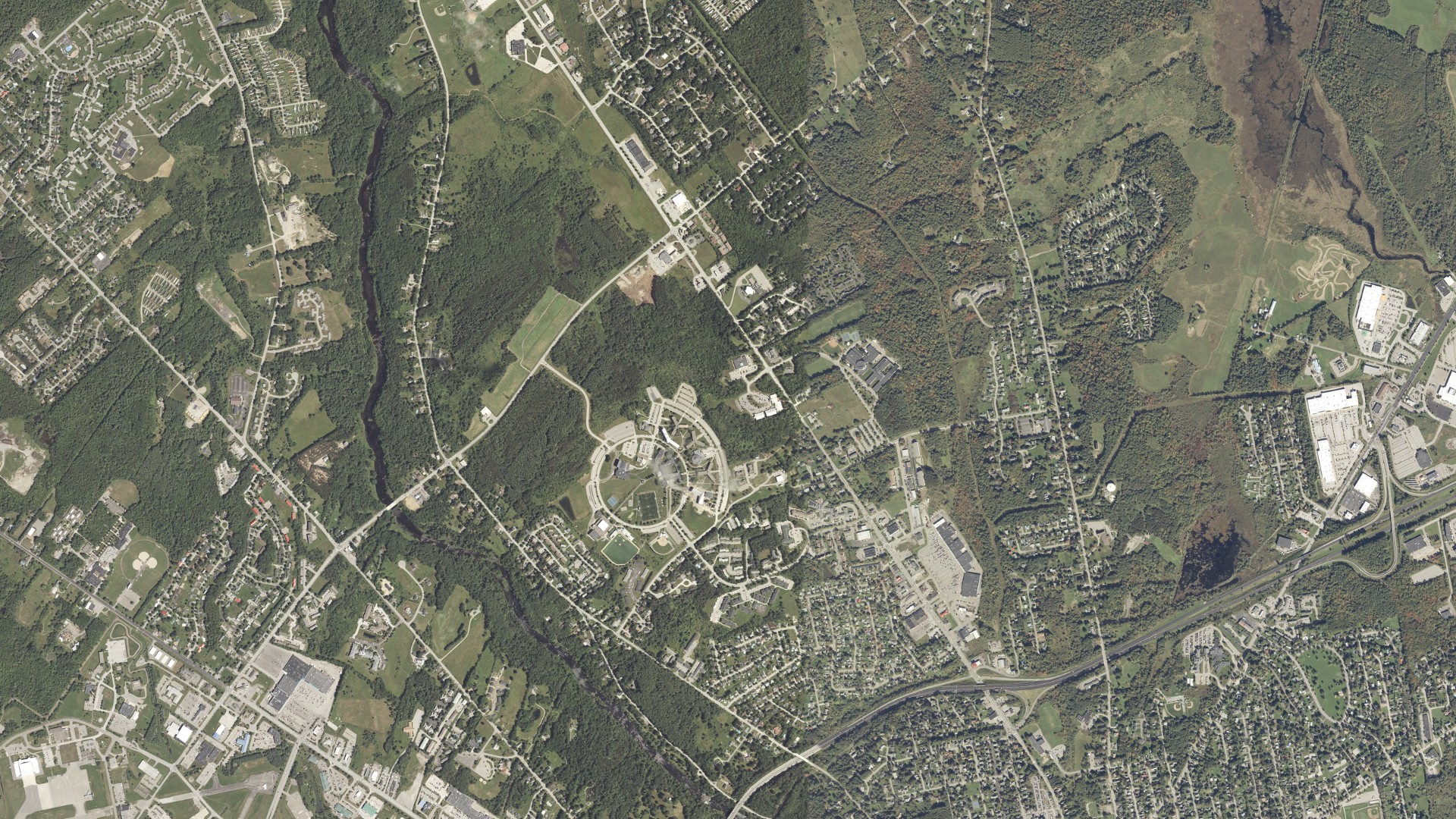 Natural-color aerial photograph of land around Bangor, Maine