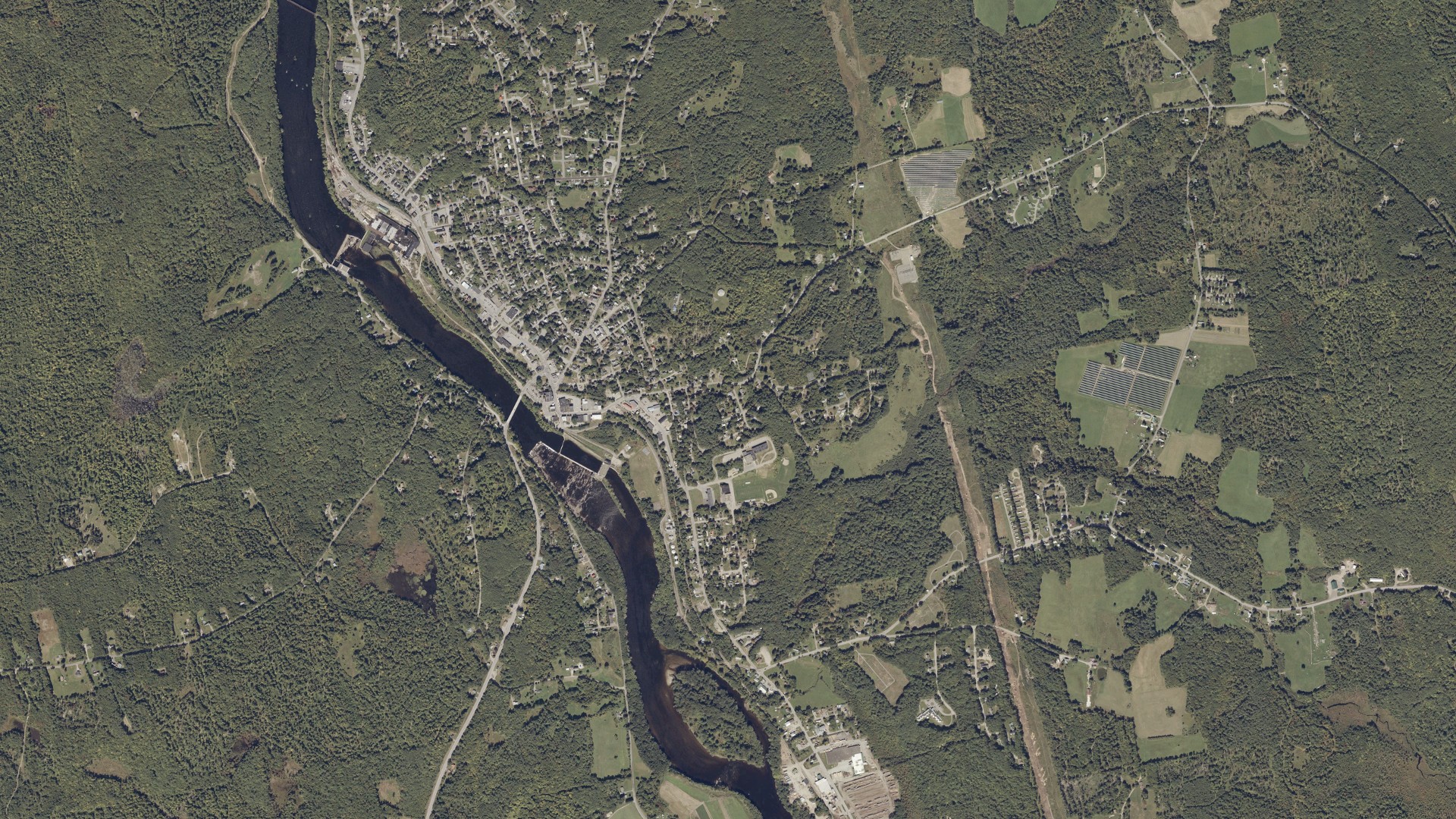 Natural-color aerial photograph of land around Livermore Falls, Maine