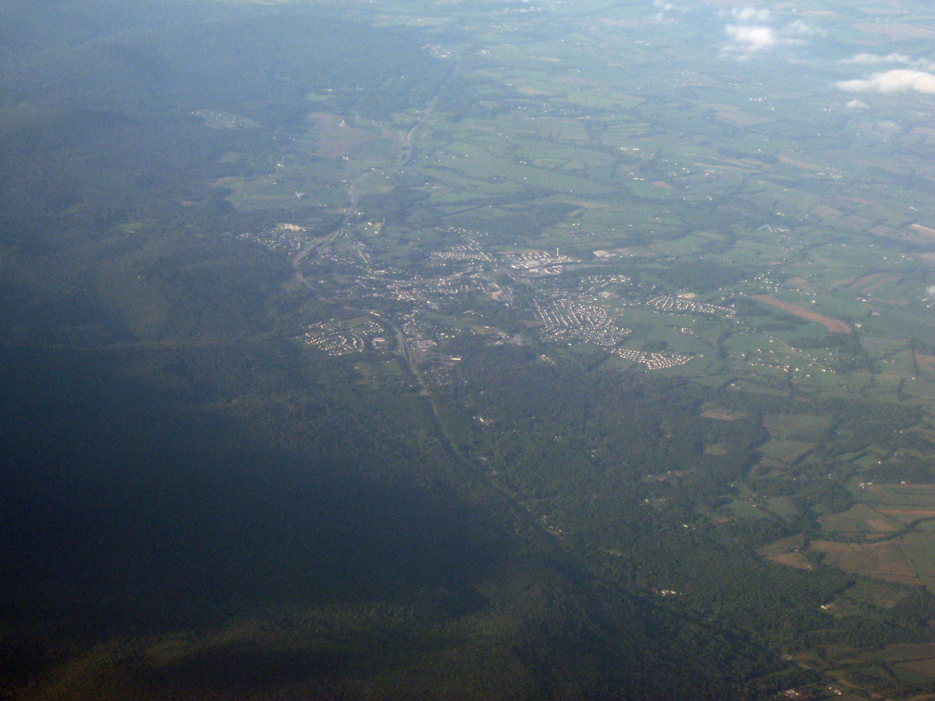Oblique air photo of Thurmont, Maryland, facing northeast, with Catoctin Mountain to the left and U.S. Route 15 going through town. August 2010. Levels enhanced in Adobe Photoshop.