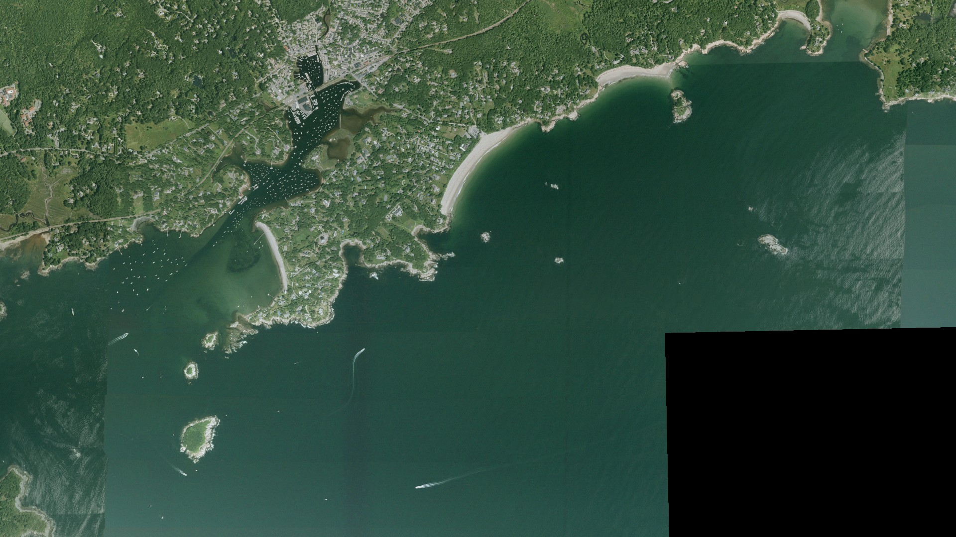 Natural-color aerial photograph of land around Manchester-by-the-Sea, Massachusetts