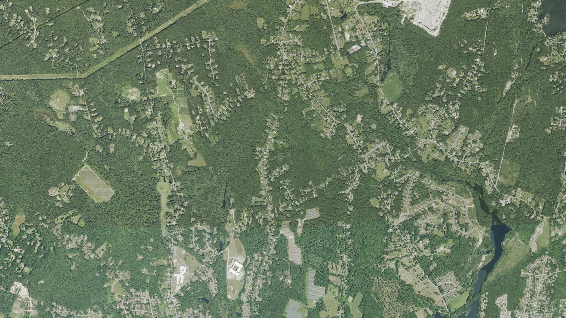 Natural-color aerial photograph of land around Blackstone, Massachusetts