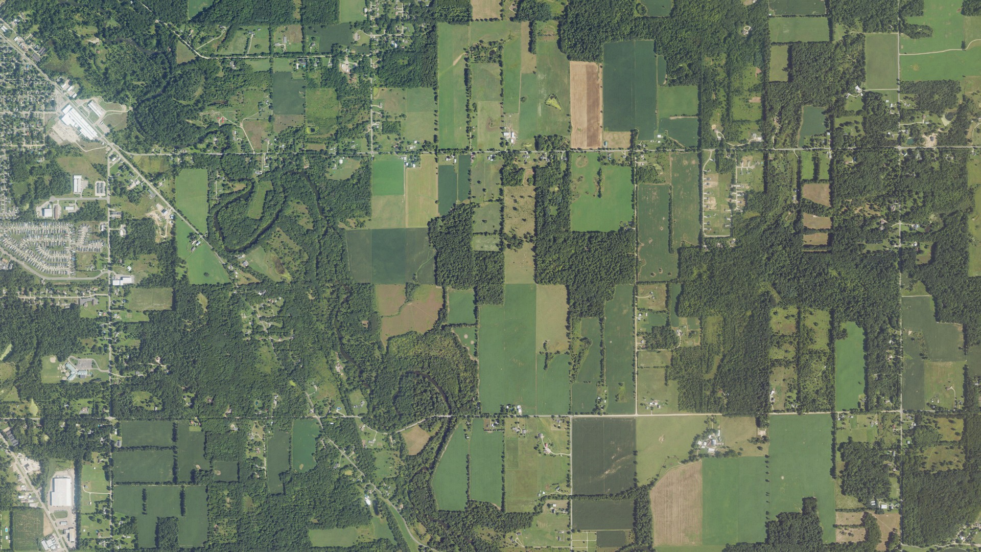 Natural-color aerial photograph of land around Hastings charter, Michigan