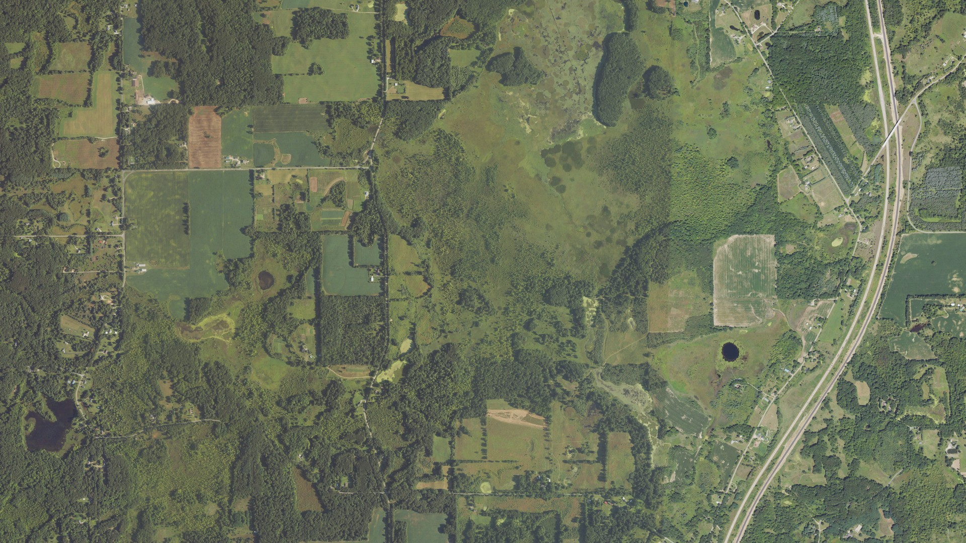 Natural-color aerial photograph of land around Convis, Michigan