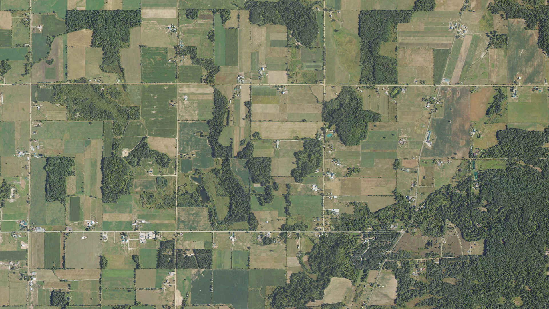 Natural-color aerial photograph of land around Sheridan, Michigan
