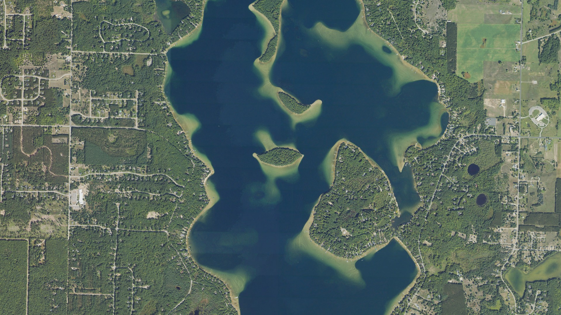 Natural-color aerial photograph of land around Long Lake, Michigan