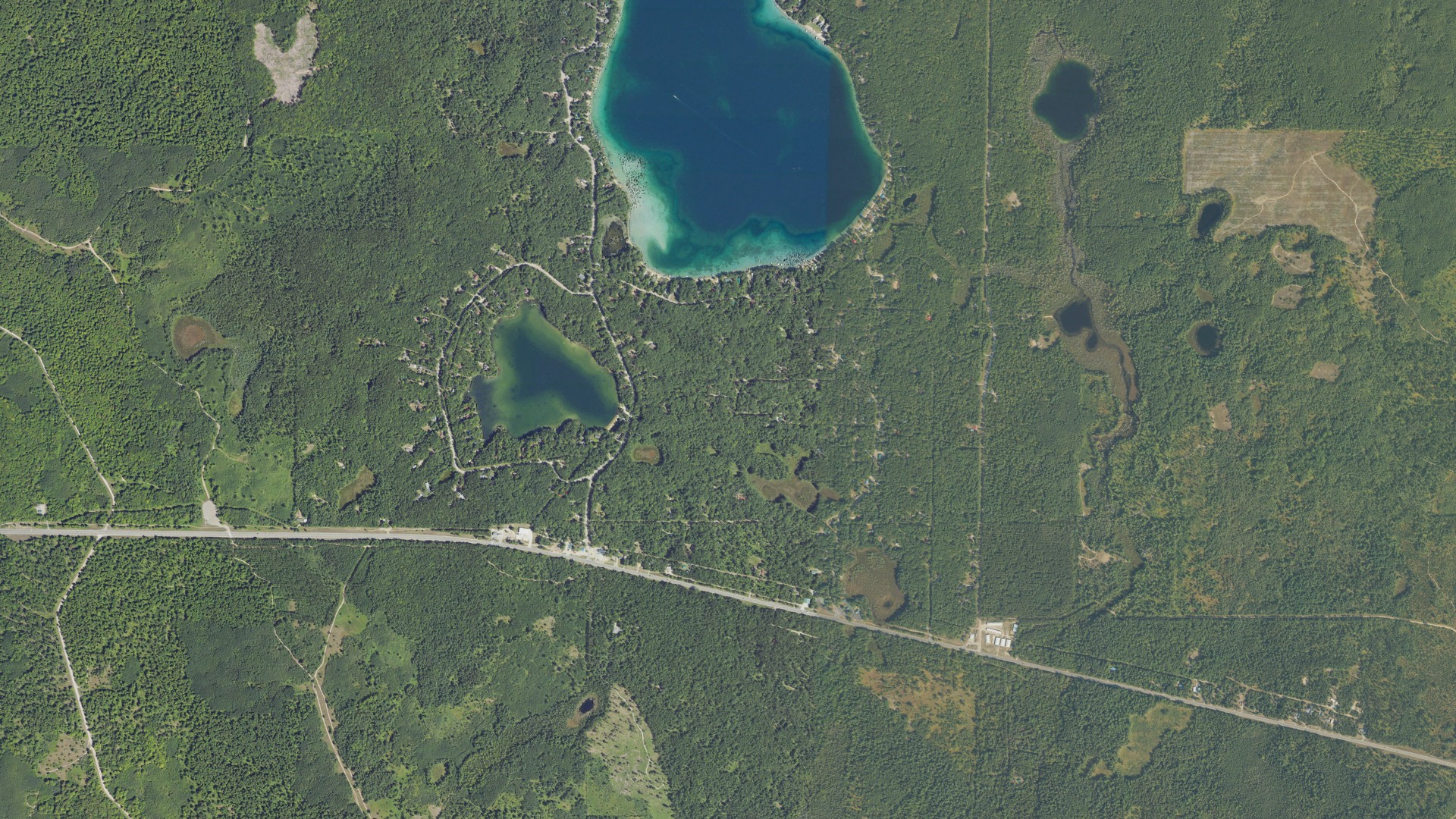 Natural-color aerial photograph of land around Bear Lake, Michigan