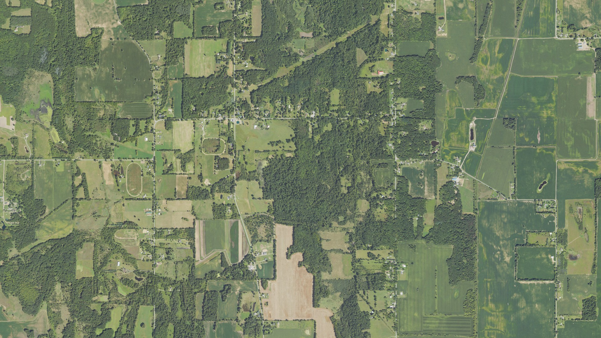 Natural-color aerial photograph of land around Bunker Hill, Michigan