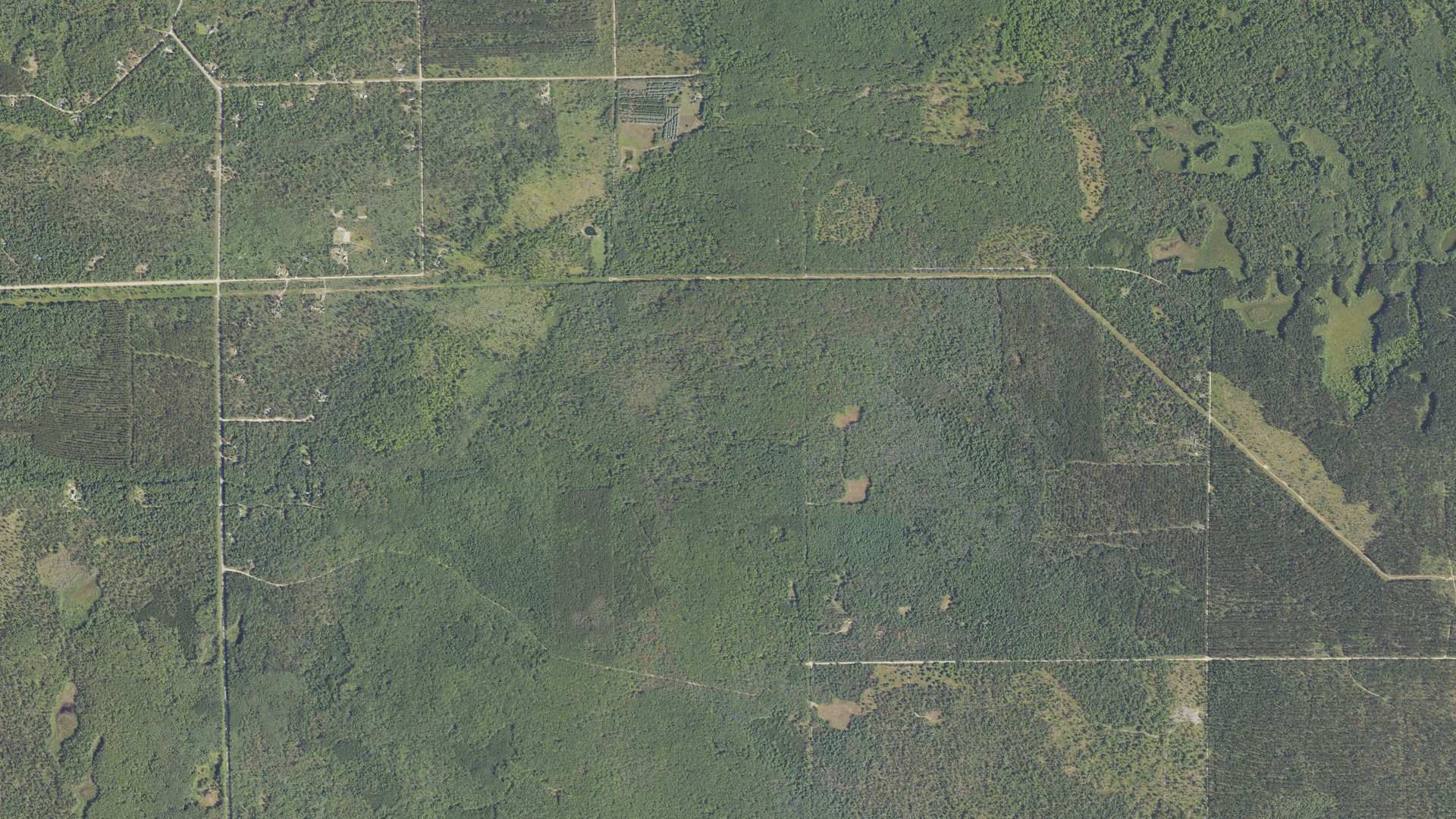 Natural-color aerial photograph of land around Yates, Michigan