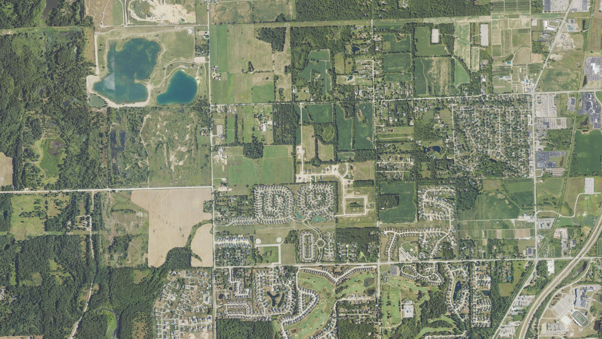 Natural-color aerial photograph of land around Washington charter, Michigan