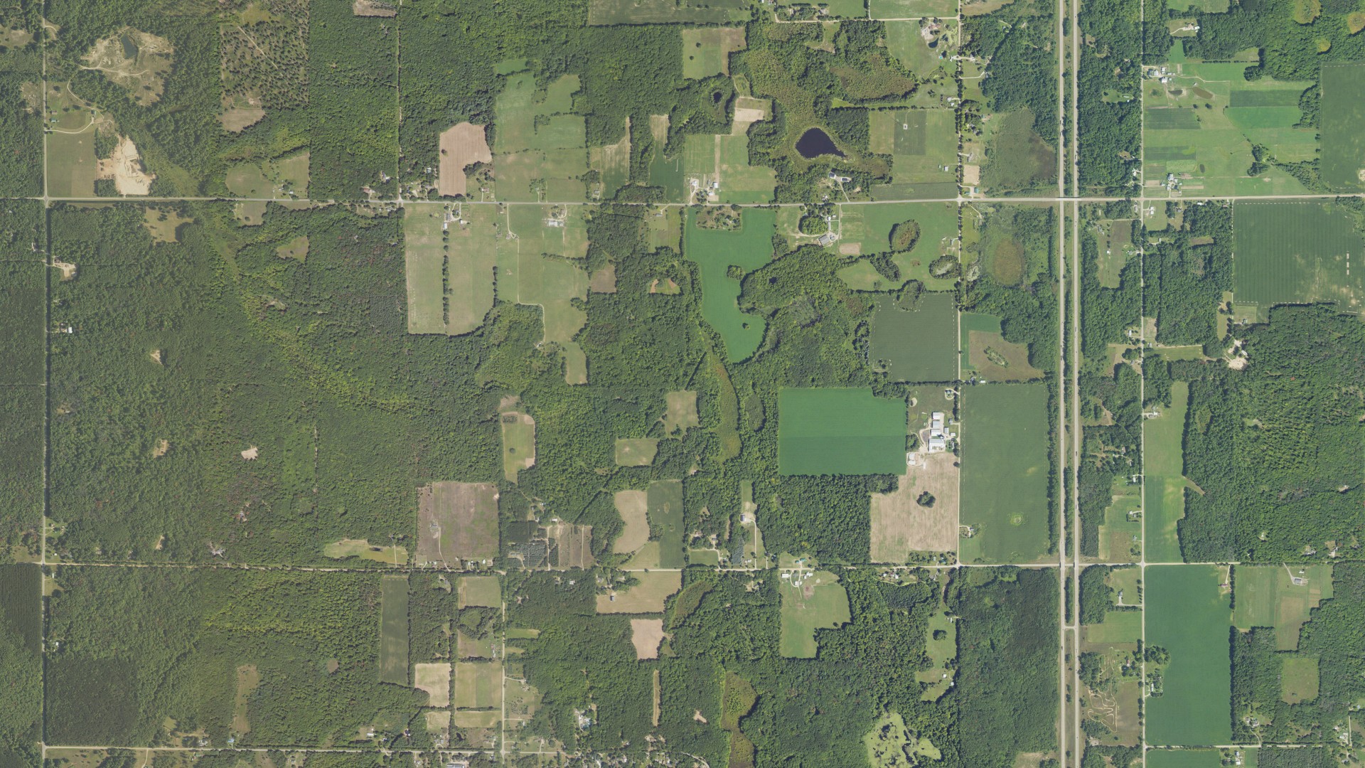 Aerial view of land around Aetna, Michigan