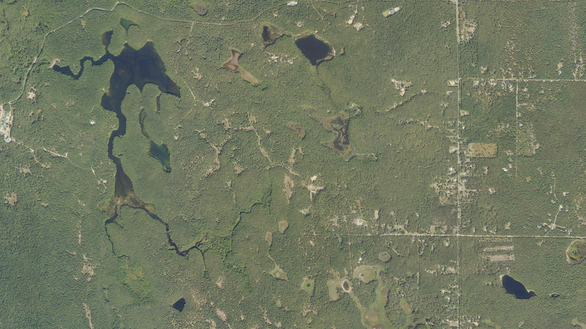 Natural-color aerial photograph of land around Blue Lake, Michigan