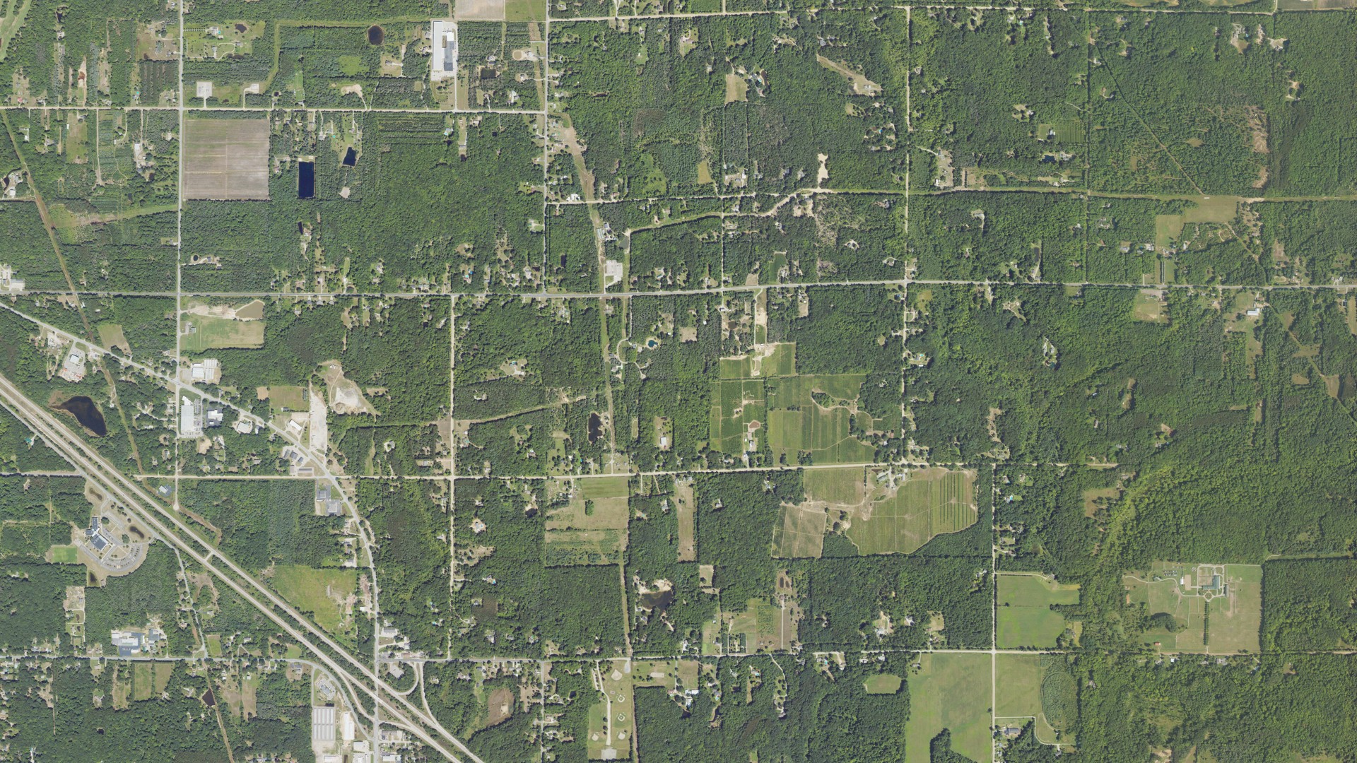 Natural-color aerial photograph of land around Fruitport charter, Michigan
