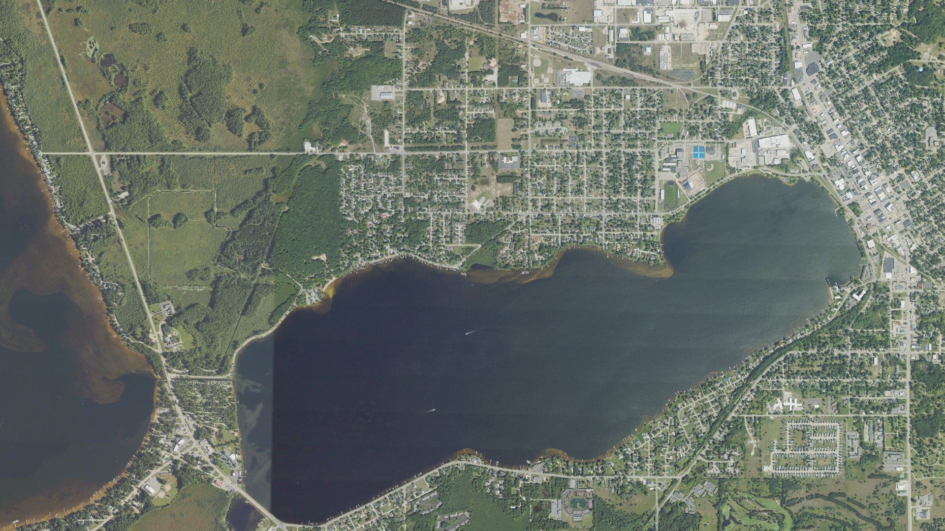 Natural-color aerial photograph of land around Cadillac, Michigan