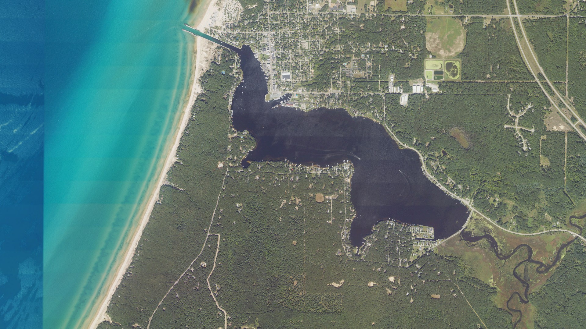 Natural-color aerial photograph of land around Pentwater, Michigan