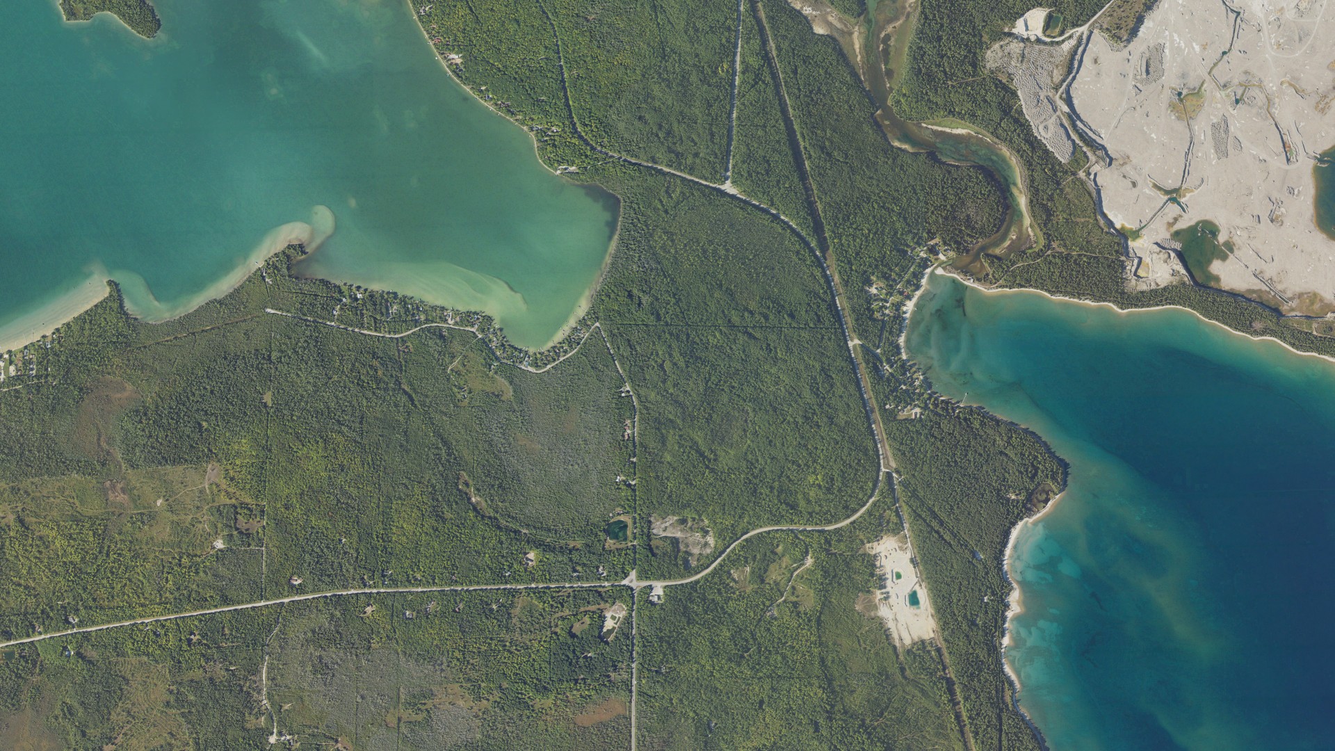 Natural-color aerial photograph of land around Presque Isle County, Michigan