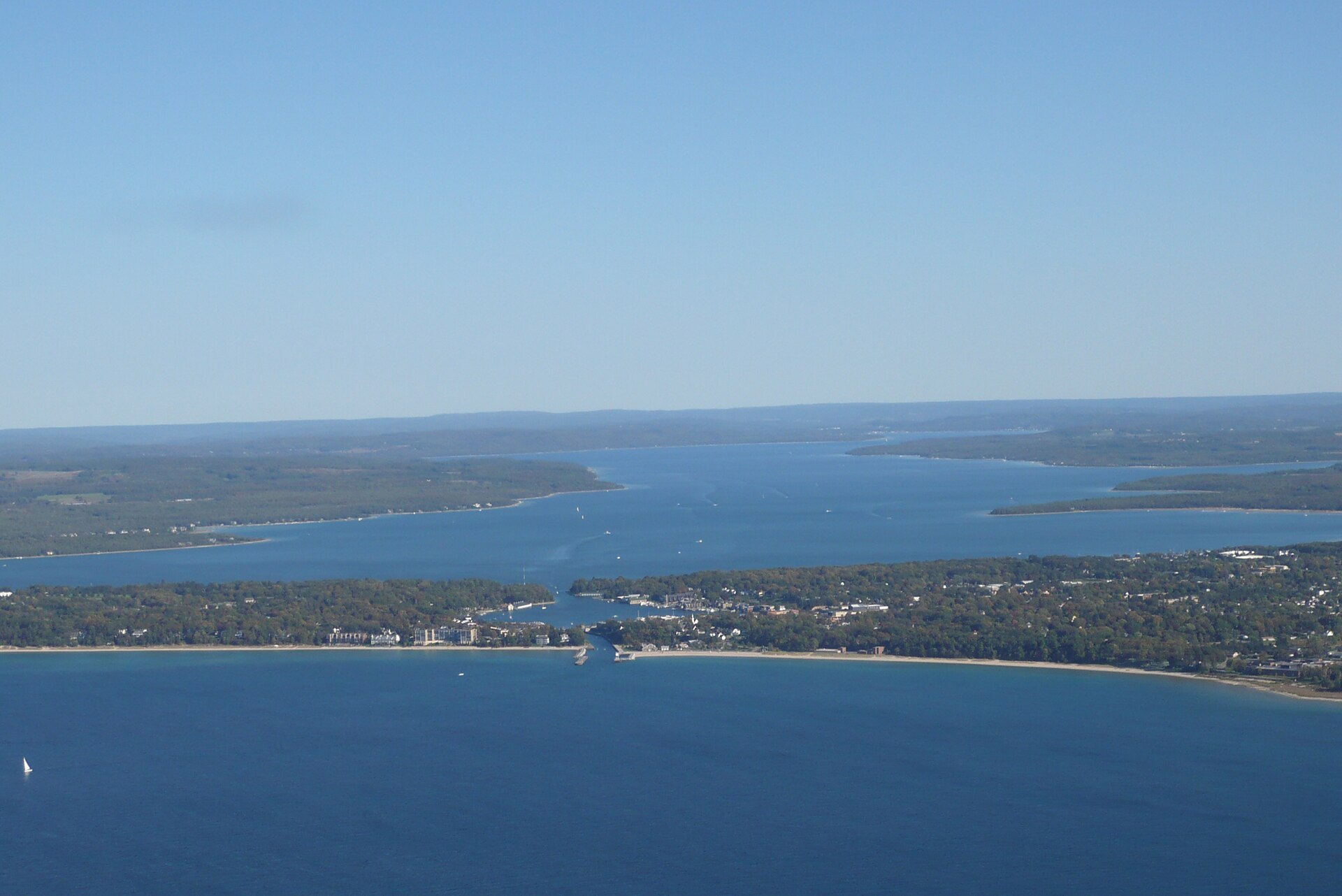 Aerial view of Charlevoix, Michigan, USA, taken from above Lake Michigan. The Pine River flows into Lake Michigan from the small Round Lake and Lake Charlevoix.