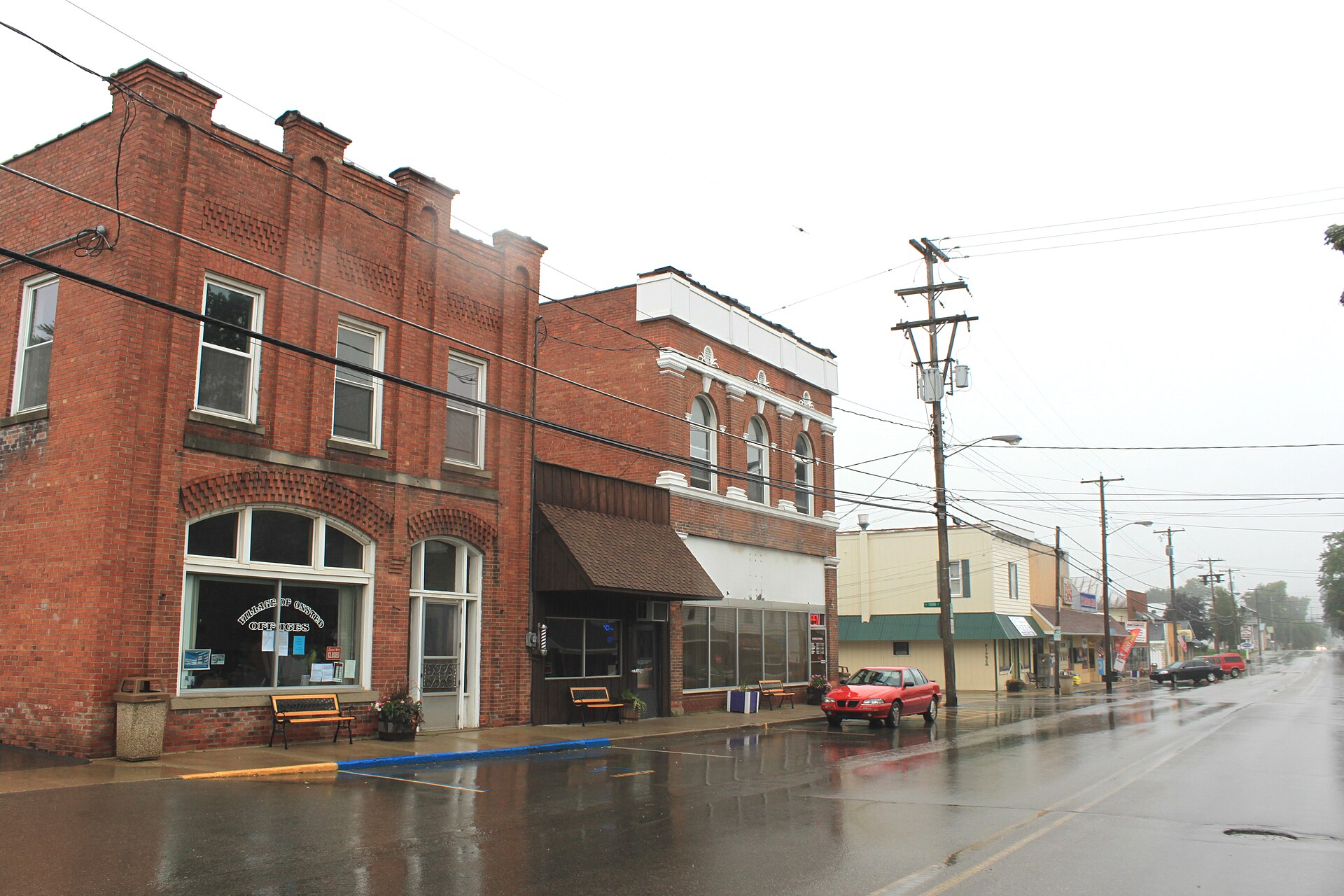 Main Street, facing north, Village of Onsted, Michigan. Village Offices building is on the left.