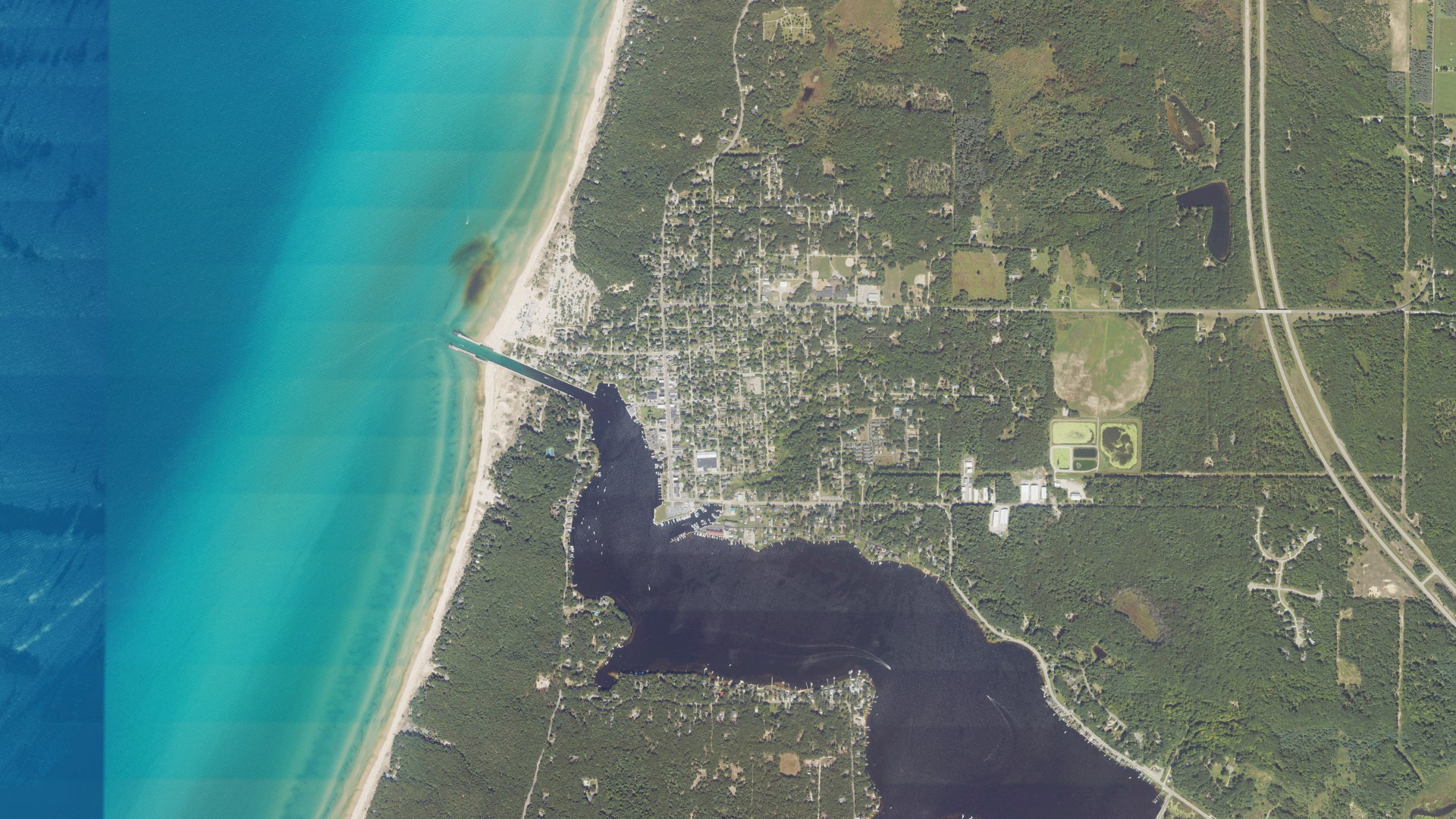 Natural-color aerial photograph of land around Pentwater, Michigan