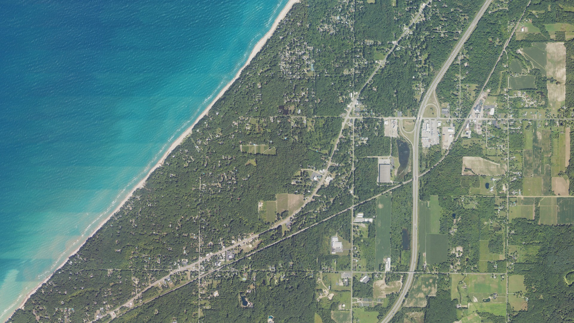 Natural-color aerial photograph of land around Shorewood-Tower Hills-Harbert, Michigan