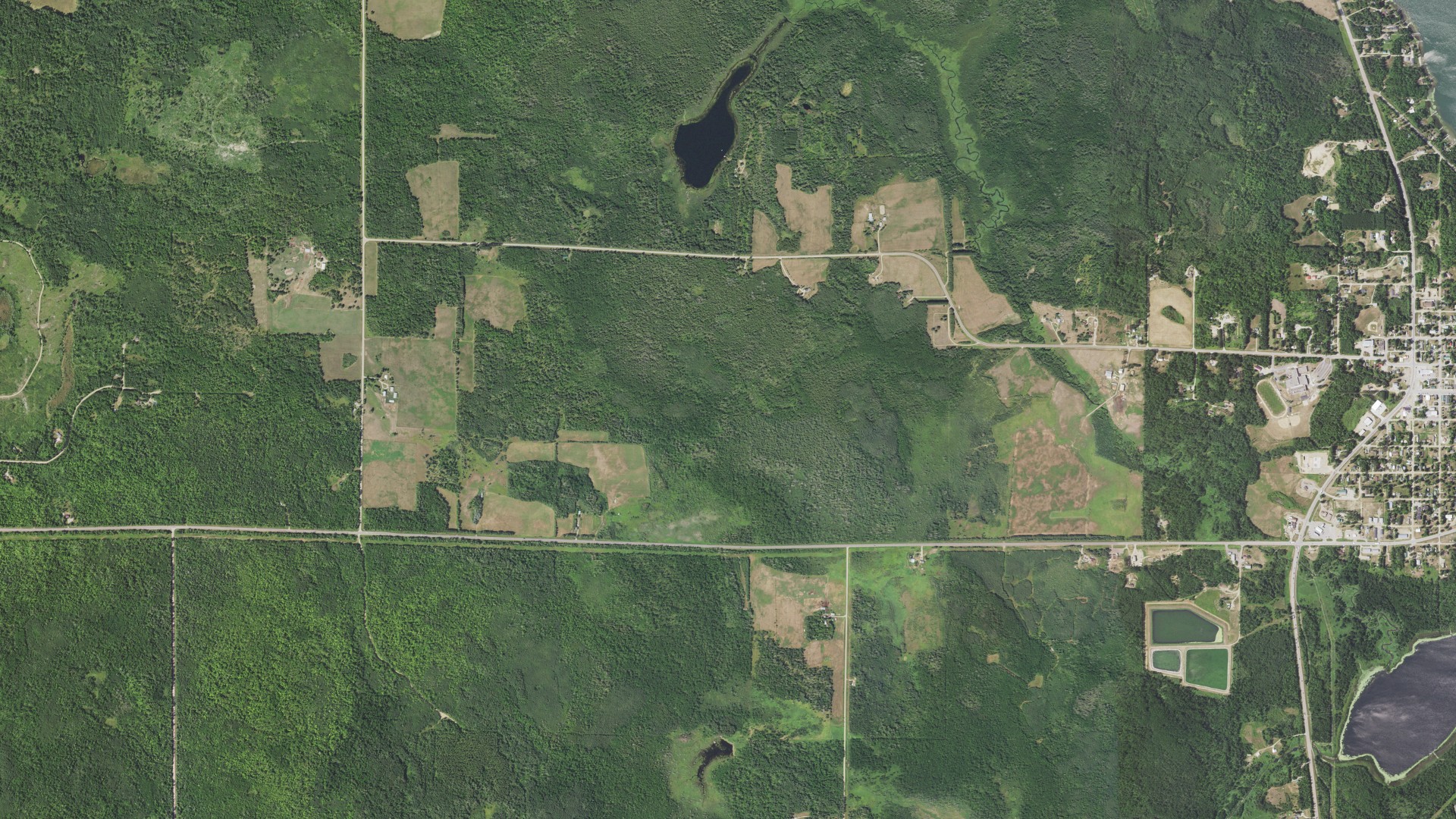 Natural-color aerial photograph of land around Hill Lake, Minnesota