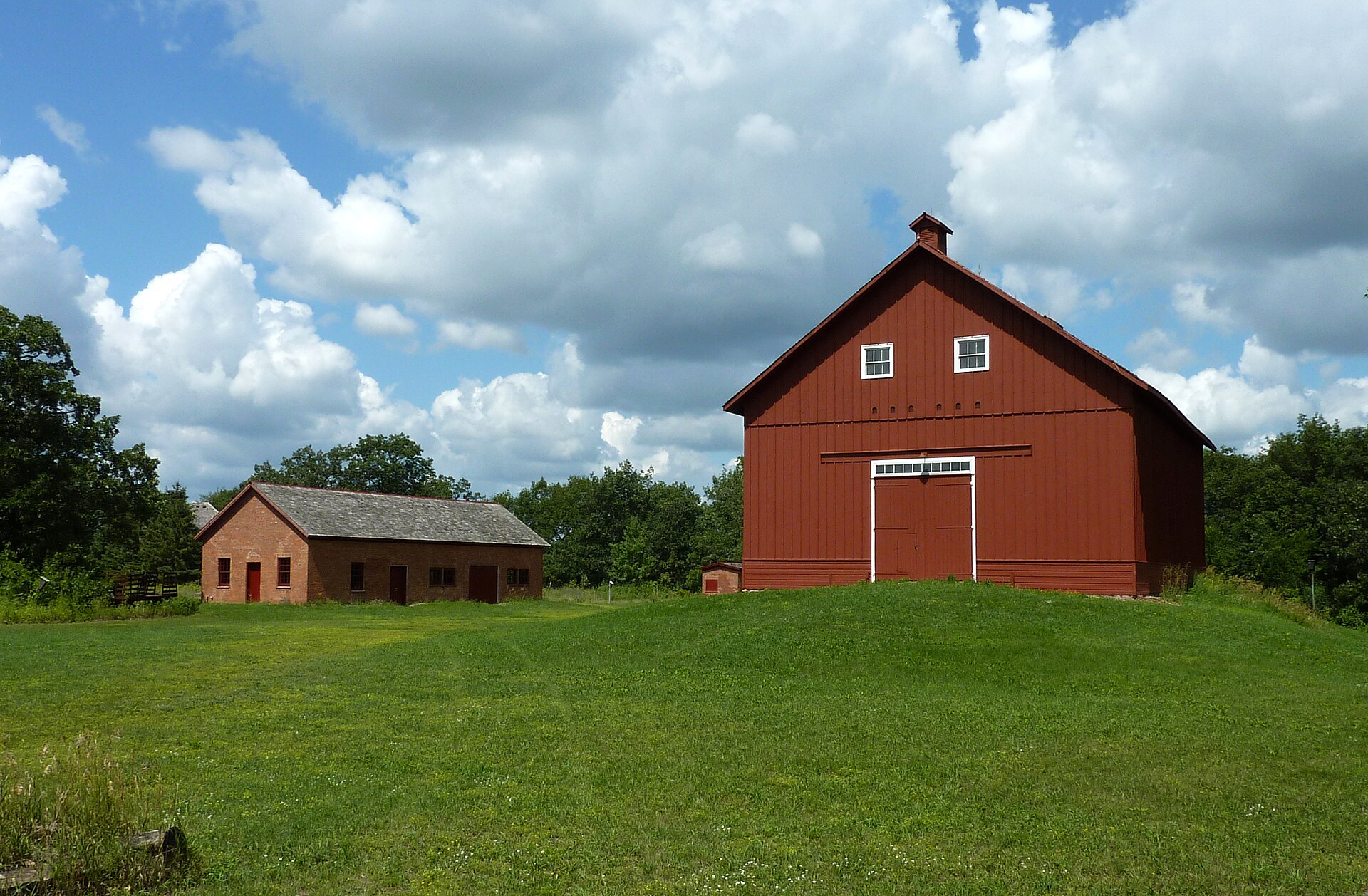 View of James J. Hill's North Oaks Farm, including the barn-shaped granary and Blacksmith Shop and Machine Shop, North Oaks, Minnesota, USA.
