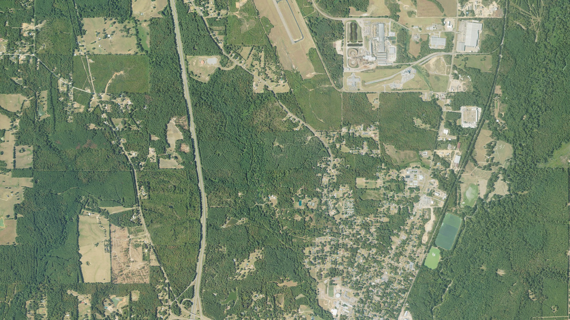 Natural-color aerial photograph of land around Magnolia, Mississippi