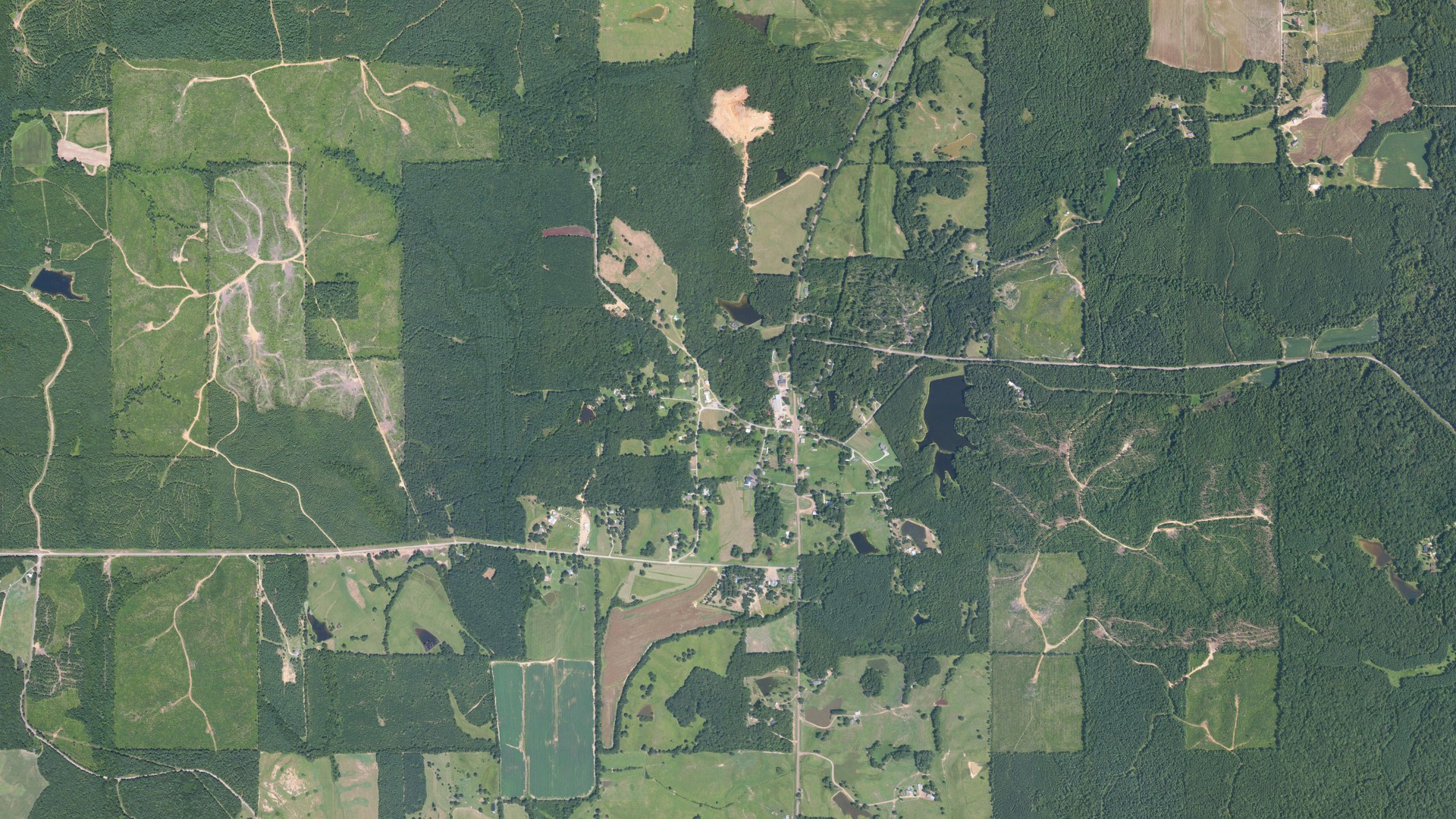 Natural-color aerial photograph of land around Slate Springs, Mississippi
