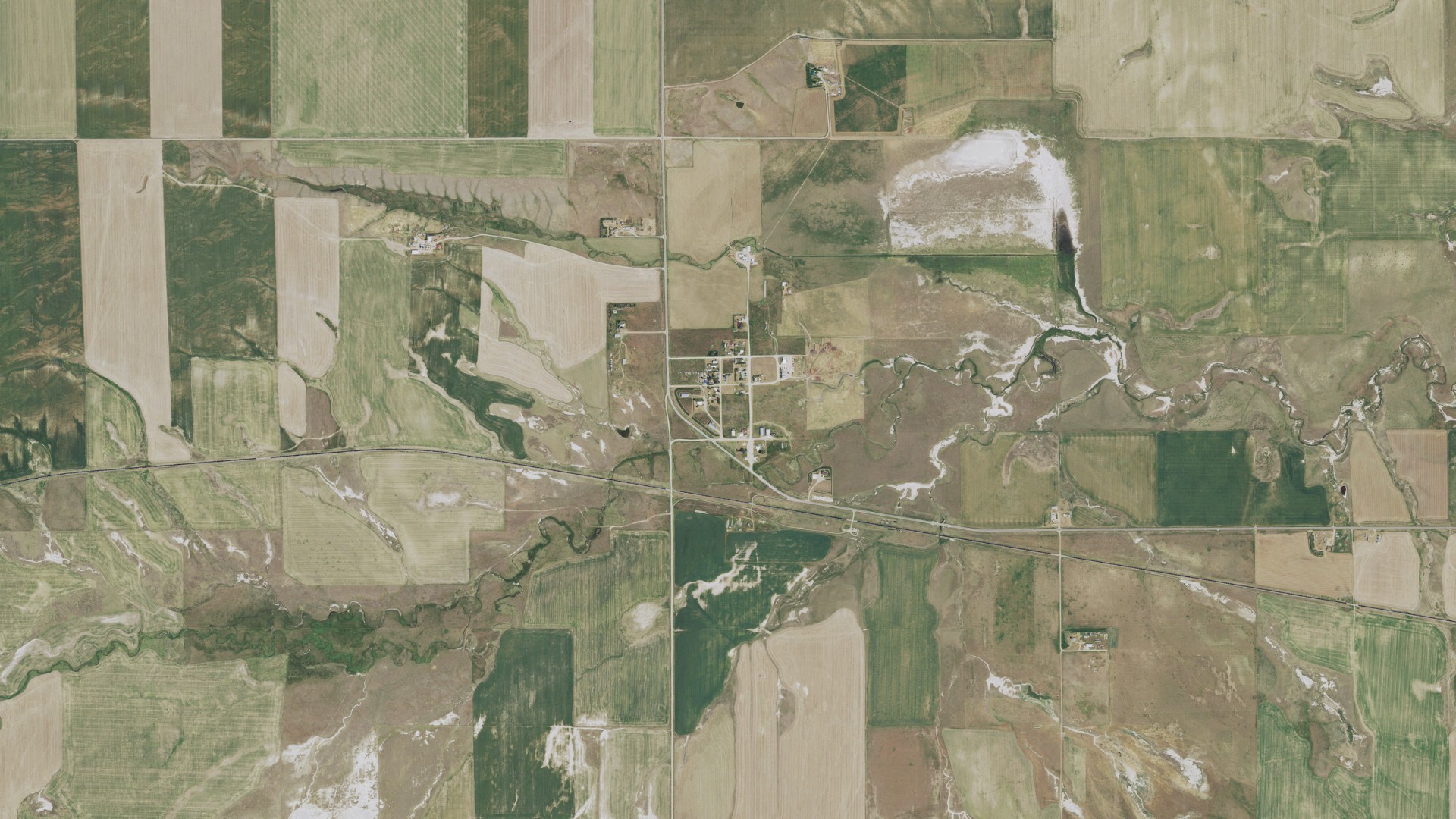 Natural-color aerial photograph of land around Coffee Creek, Montana