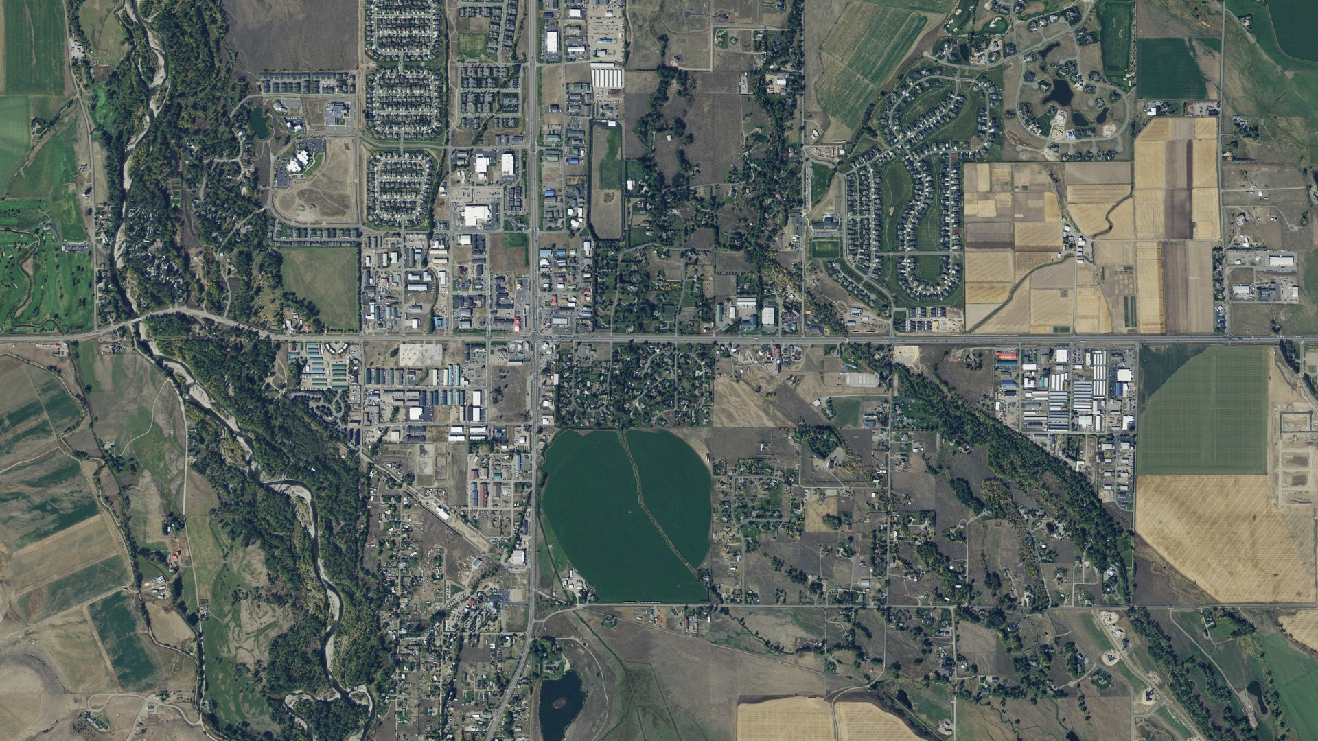 Natural-color aerial photograph of land around Four Corners, Montana
