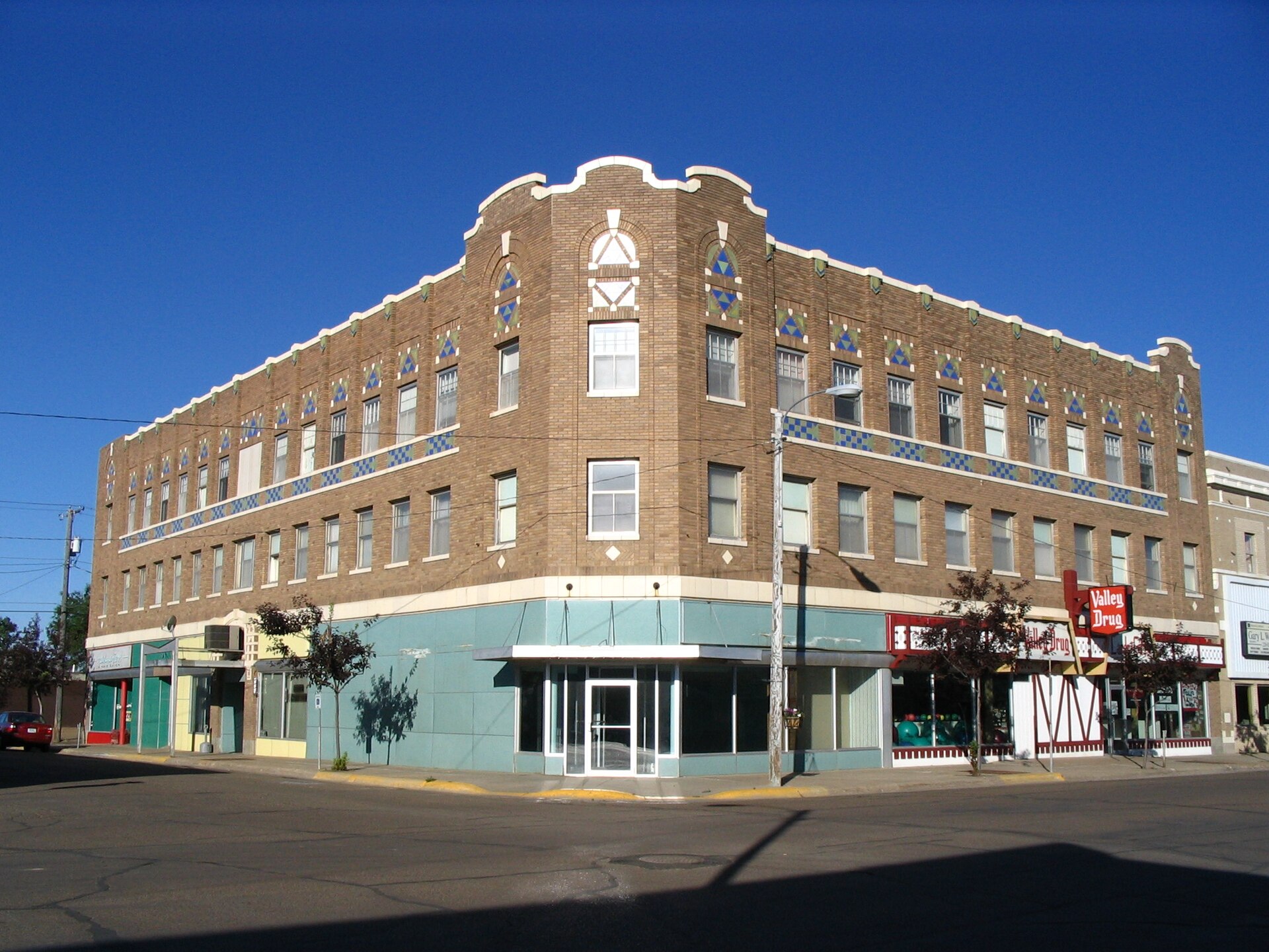 Rundle Building (208 5th Street South) Interest in Spanish Mission architecture reached its height in 1915, after the Panama California Exposition popularized the style far beyond the Southwest. — Glasgow, Montana