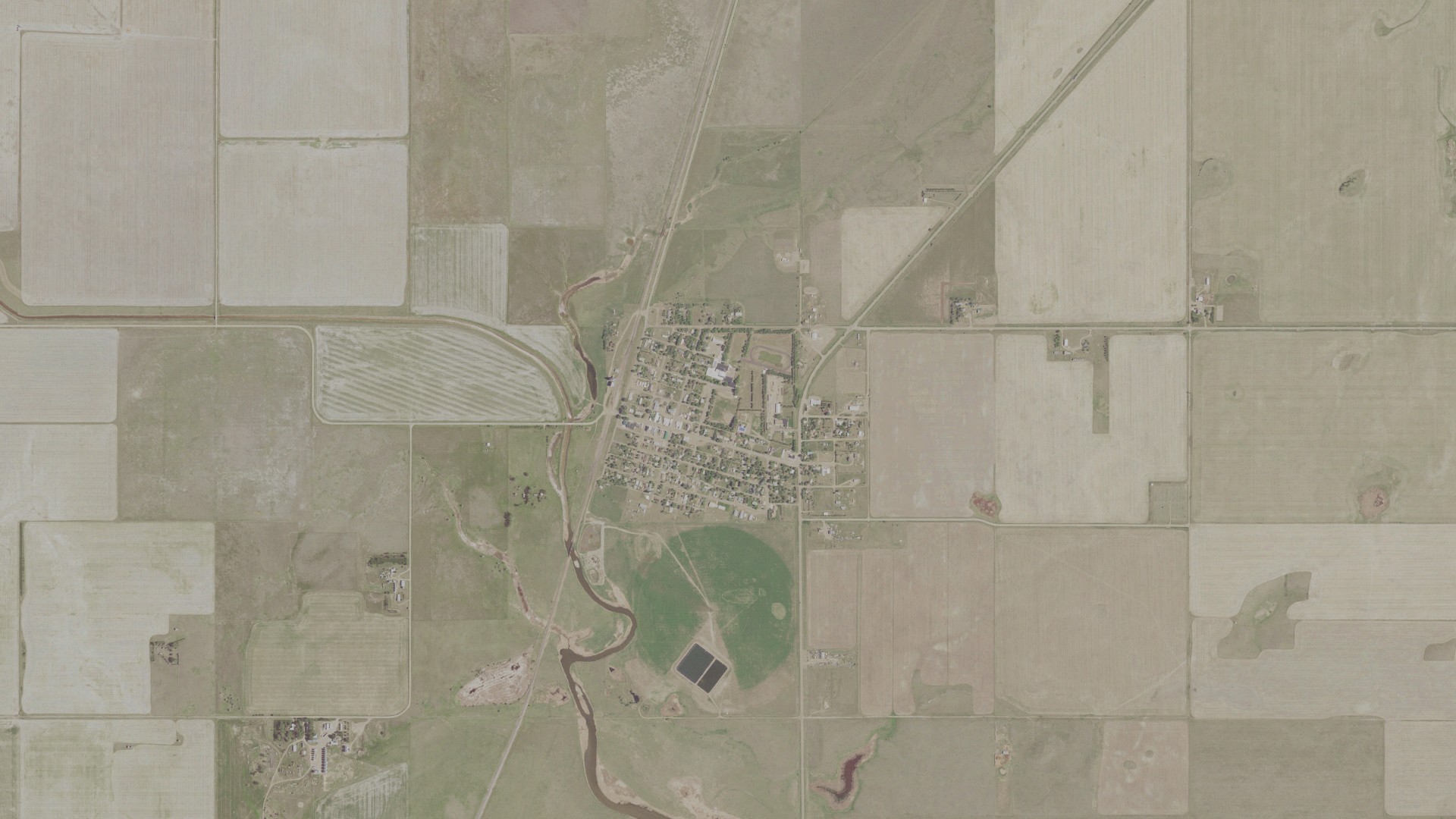 Natural-color aerial photograph of land around Medicine Lake, Montana