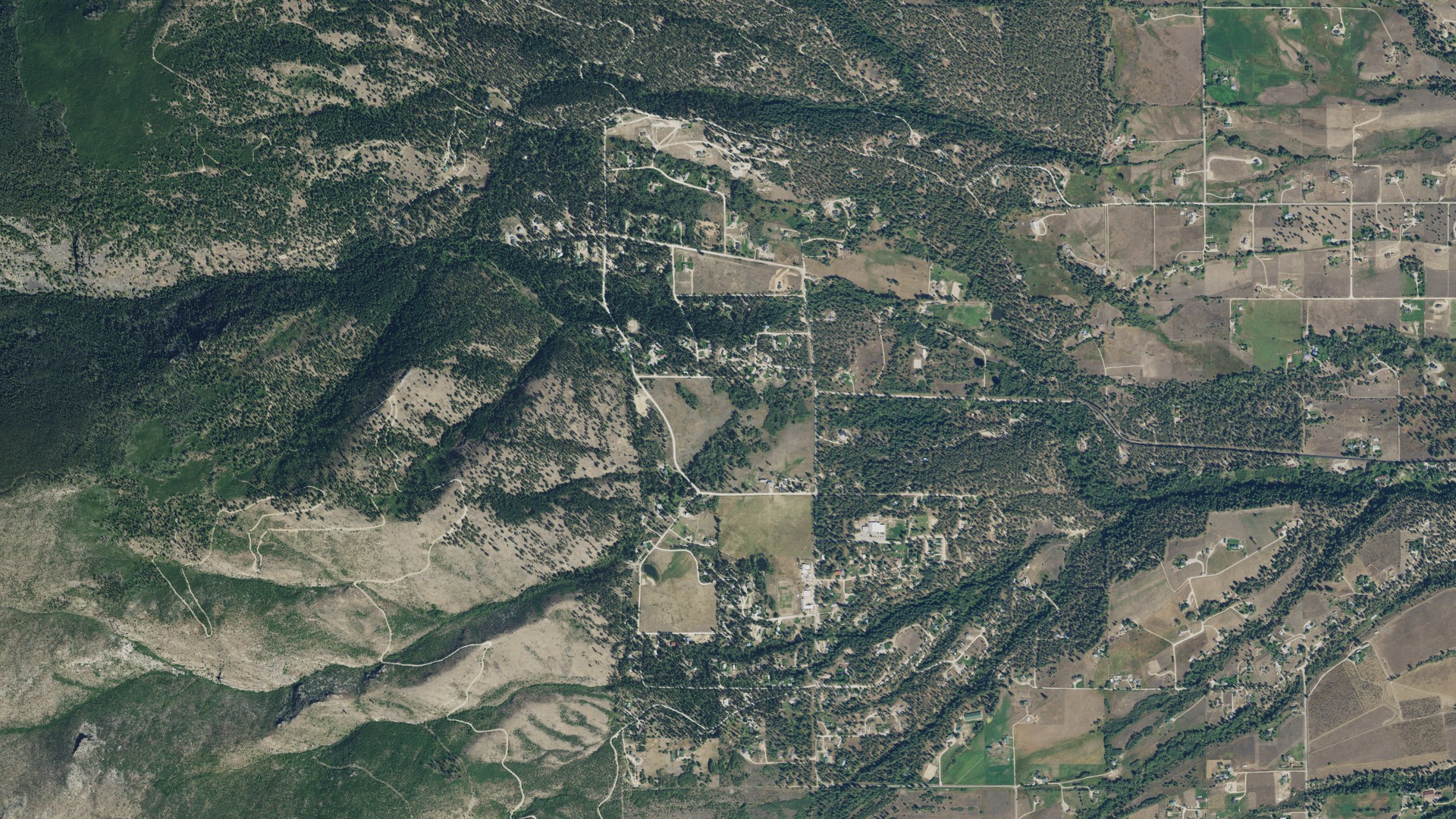 Natural-color aerial photograph of land around Pinesdale, Montana