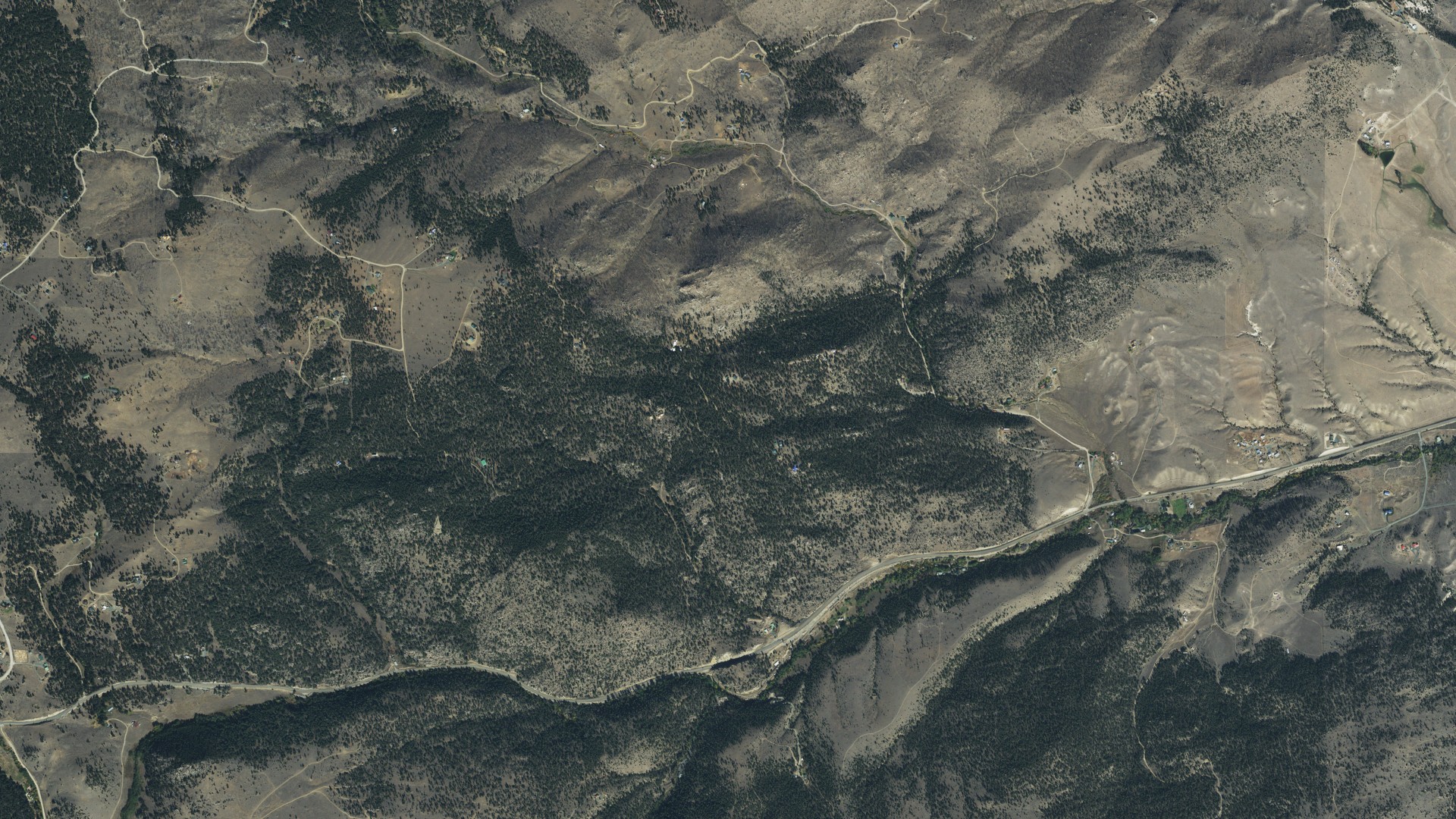 Natural-color aerial photograph of land around Rader Creek, Montana