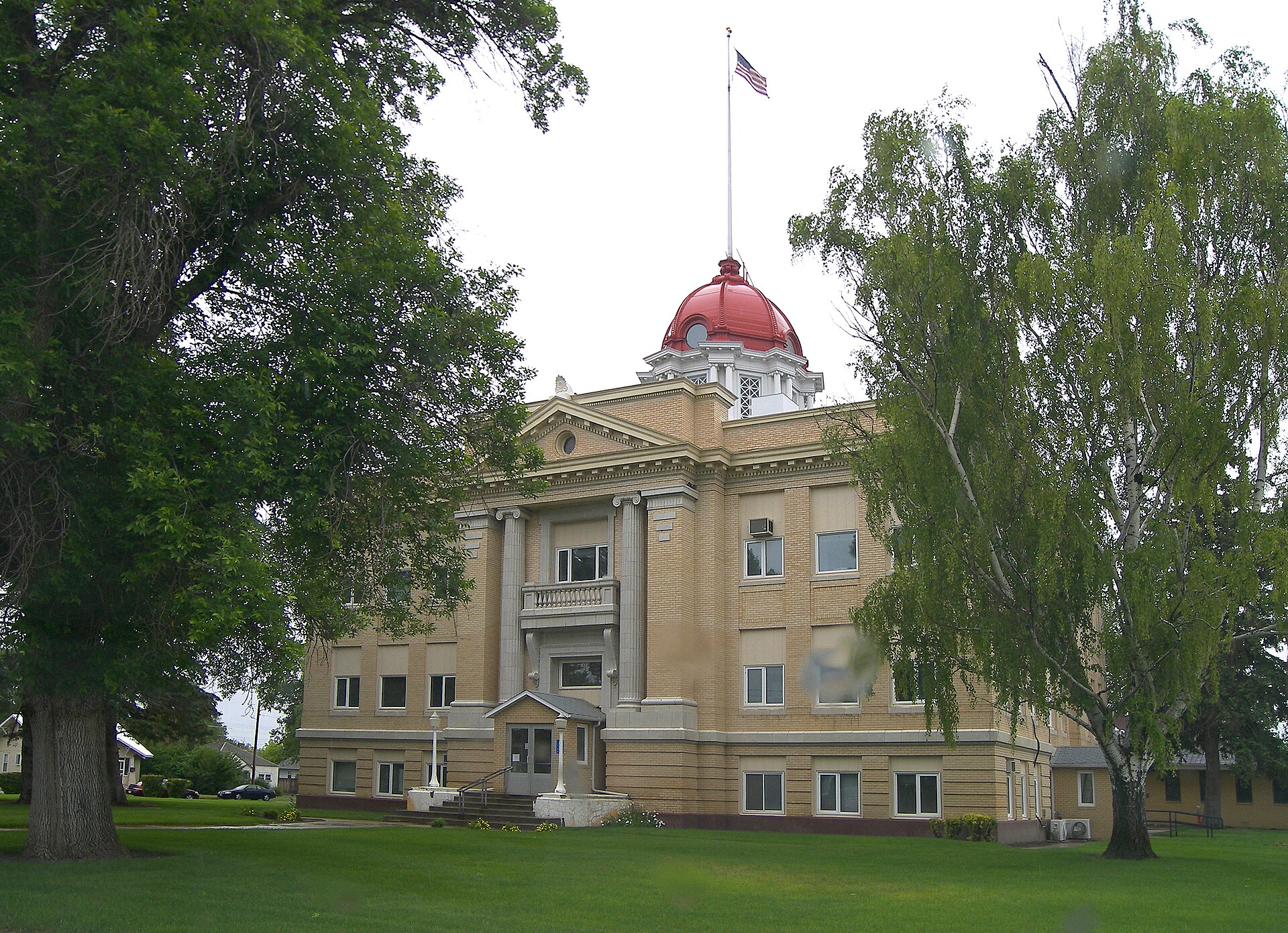 The Richland County, Montana Courthouse located in Sidney, Montana, United States. The image was taken through a windshield on a rainy day so there are a couple of rain drops worth of distortion.