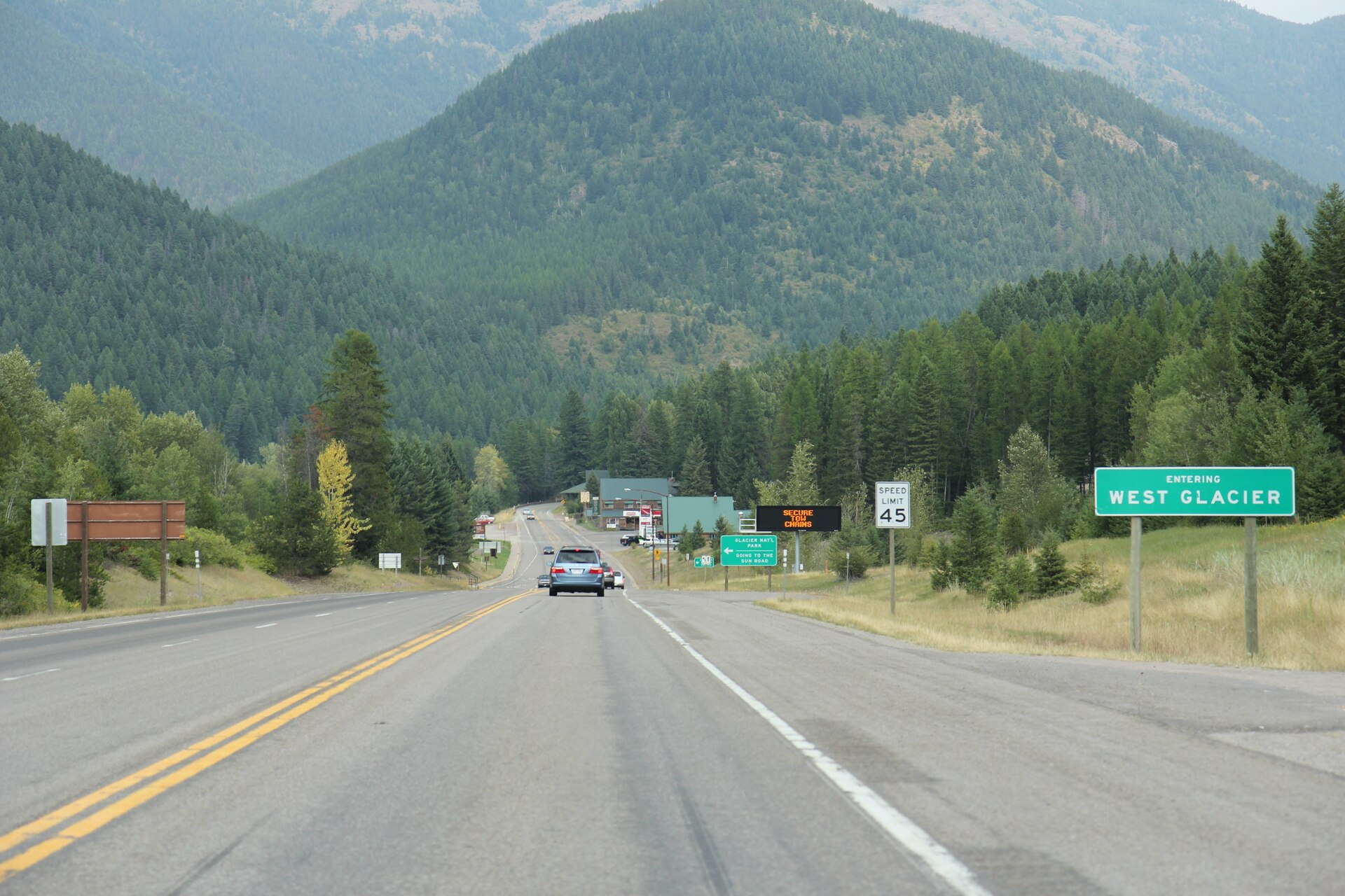 Looking east at the sign for West Glacier, Montana on U.S. Route 2.