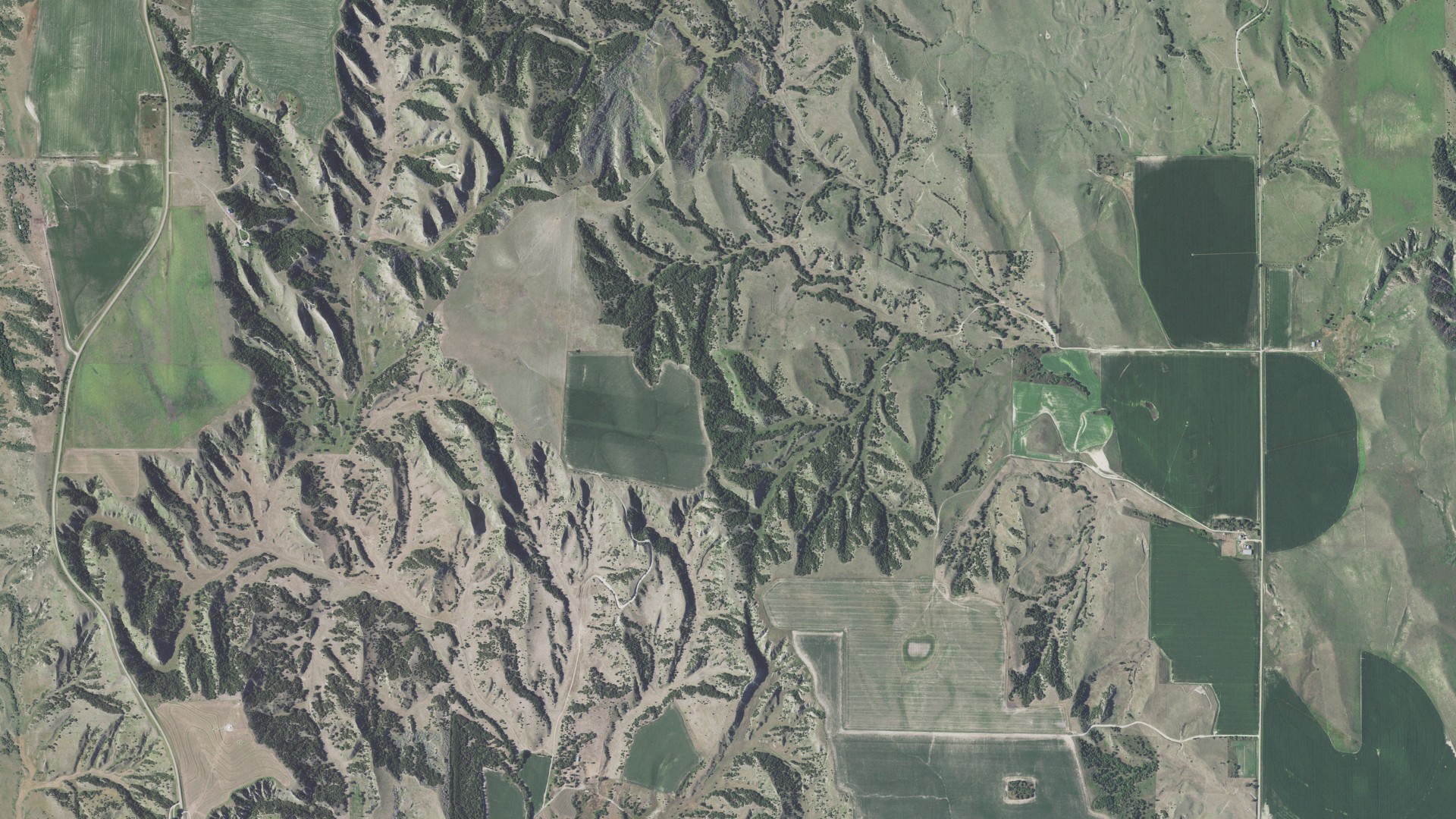 Natural-color aerial photograph of land around Arnold, Nebraska