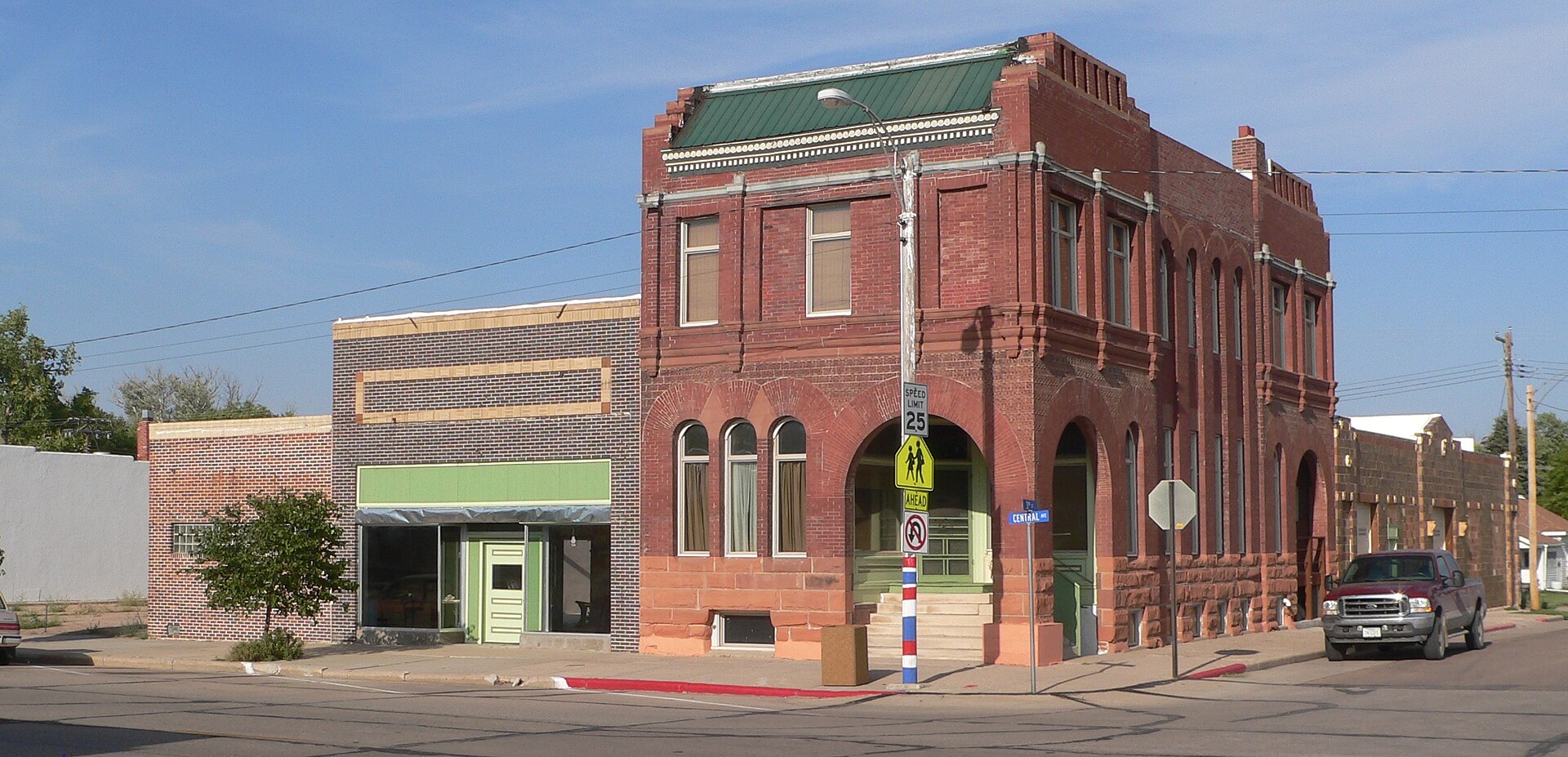 Downtown Grant, Nebraska: northeast corner of 3rd and Central, seen from the southwest. Central Avenue runs northward to the left; 3rd Street runs eastward at the right edge of the photo.