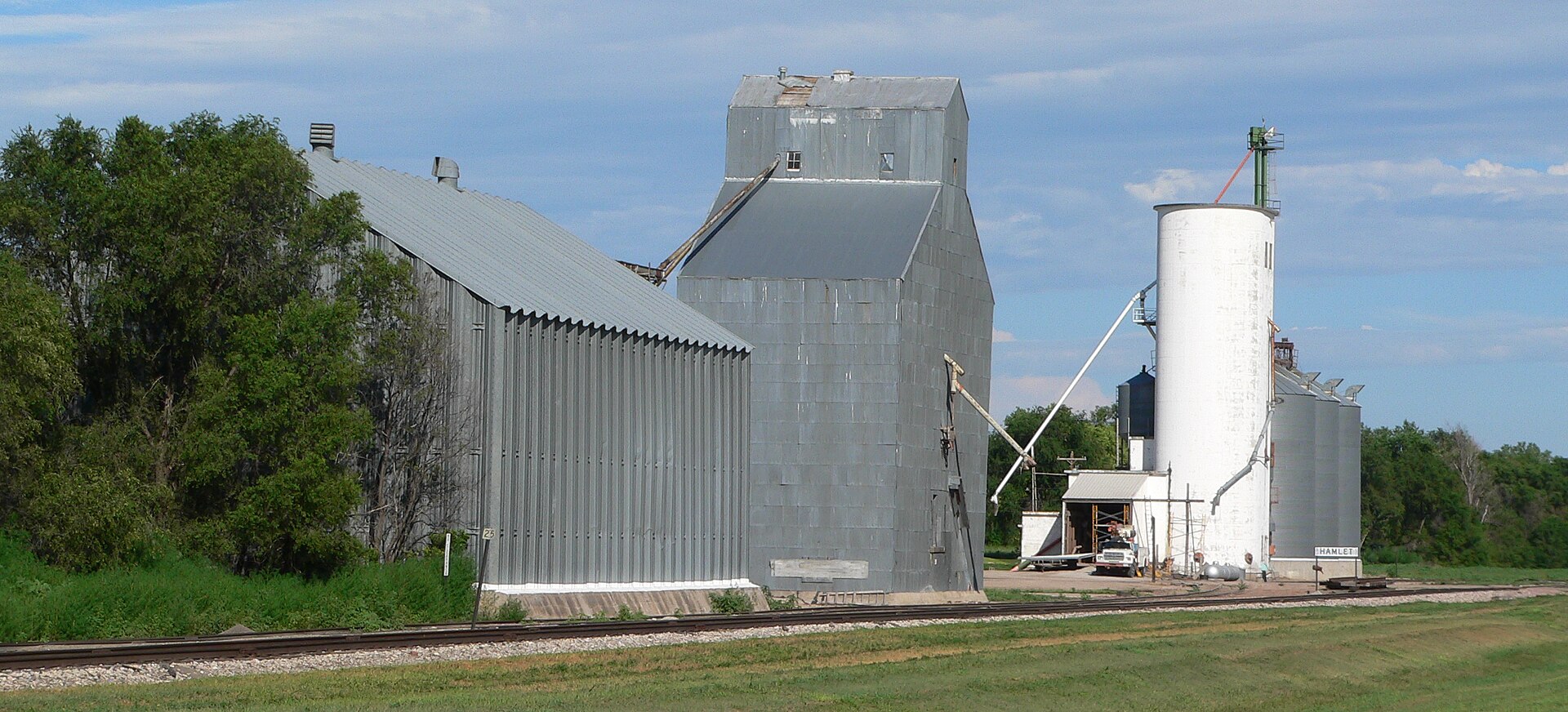 Grain elevators at southern edge of Hamlet, Nebraska.