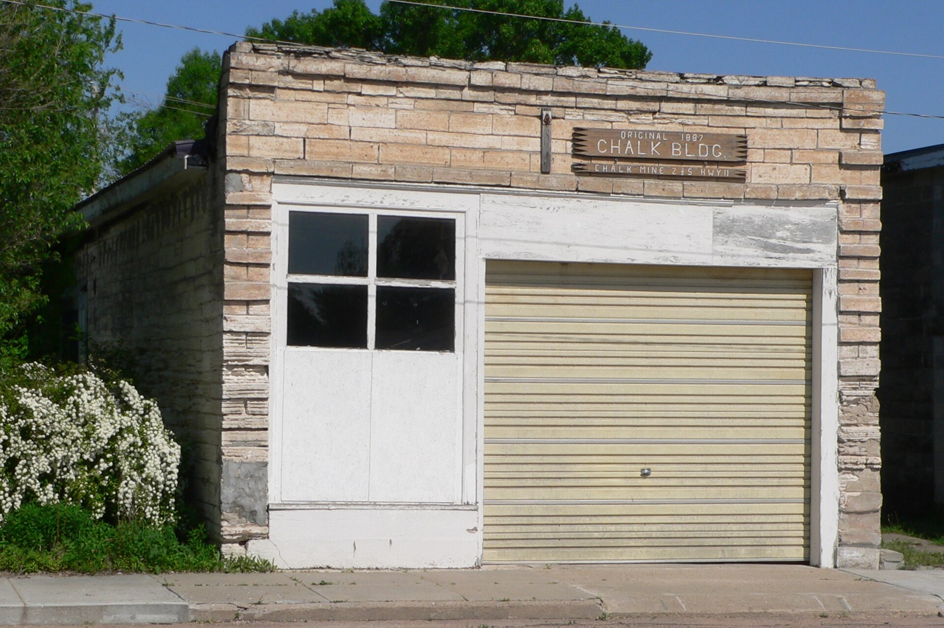 Scotia Chalk Building in Scotia, Nebraska; seen from the northwest. The building was constructed in 1887, using chalk rock from a local quarry. It is listed in the National Register of Historic Places.