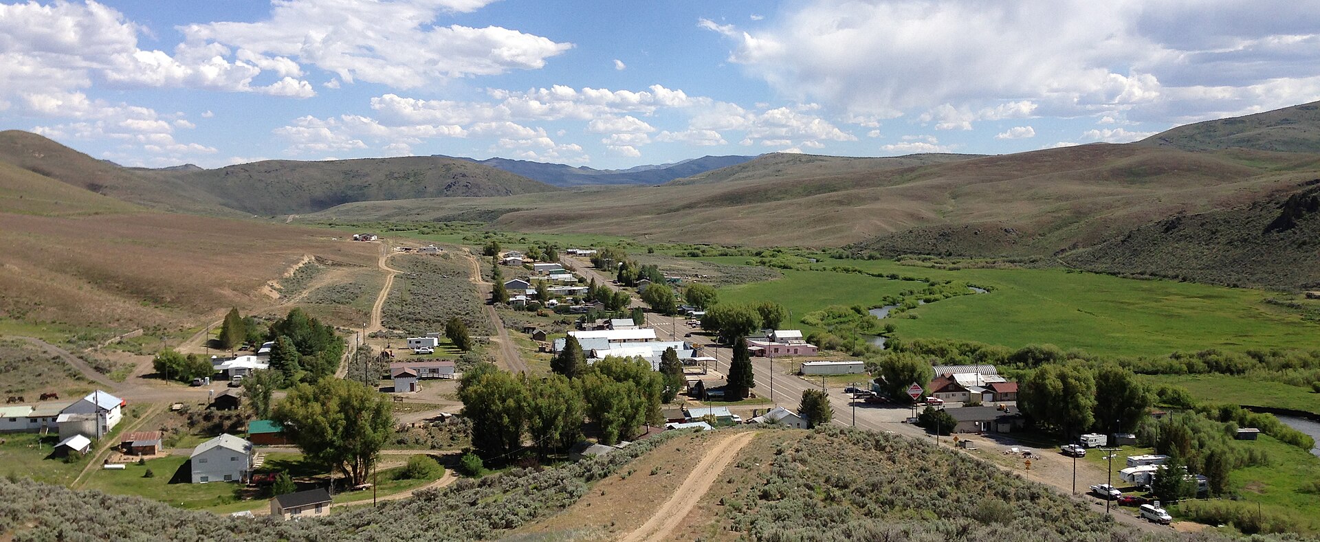 View south across Mountain City, Nevada, with Nevada State Route 225 visible passing through town and the Owyhee River visible toward the right